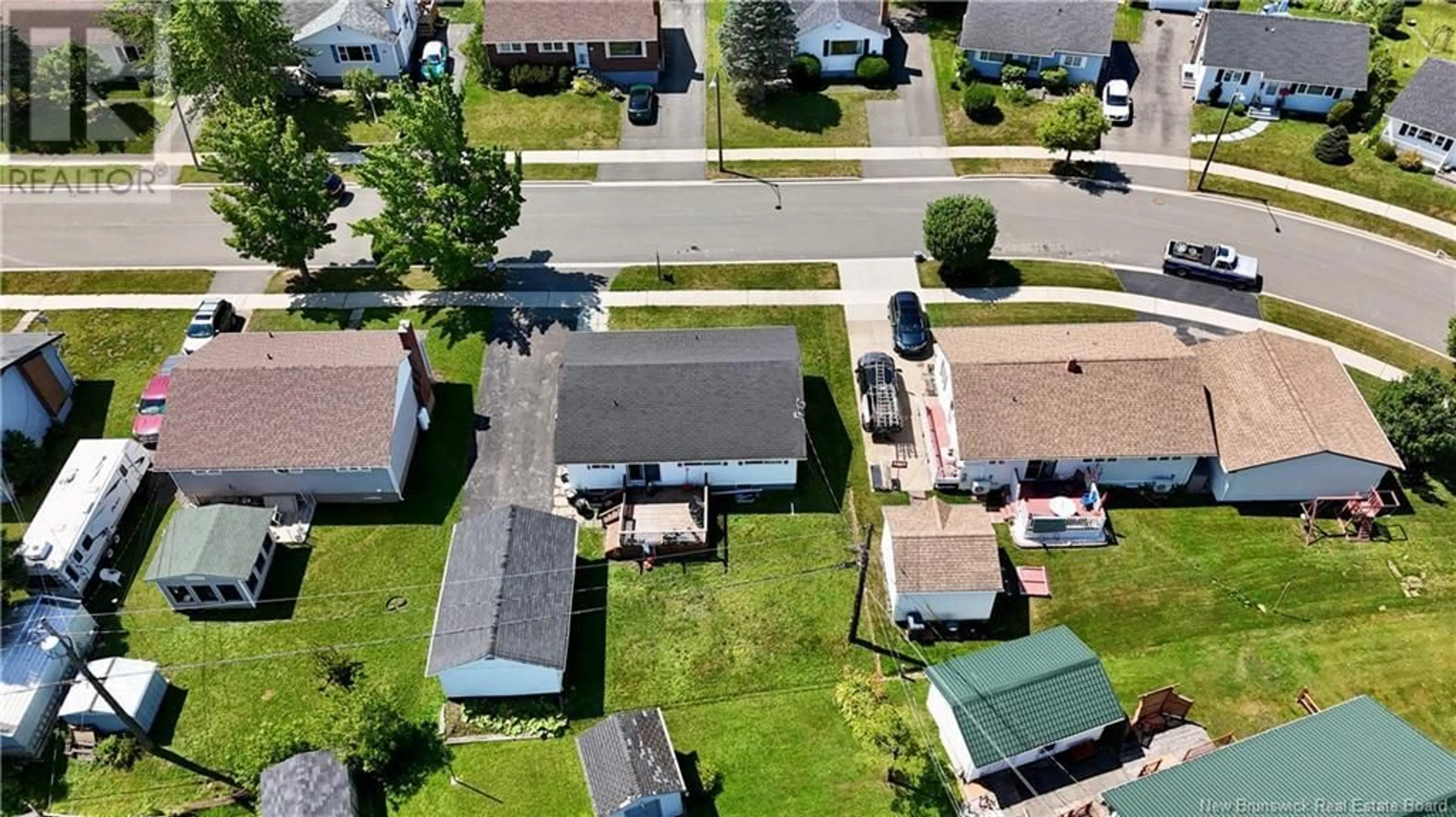 A pic from outside/outdoor area/front of a property/back of a property/a pic from drone, street for 51 WINDEMERE DRIVE, Moncton New Brunswick E1C4L2