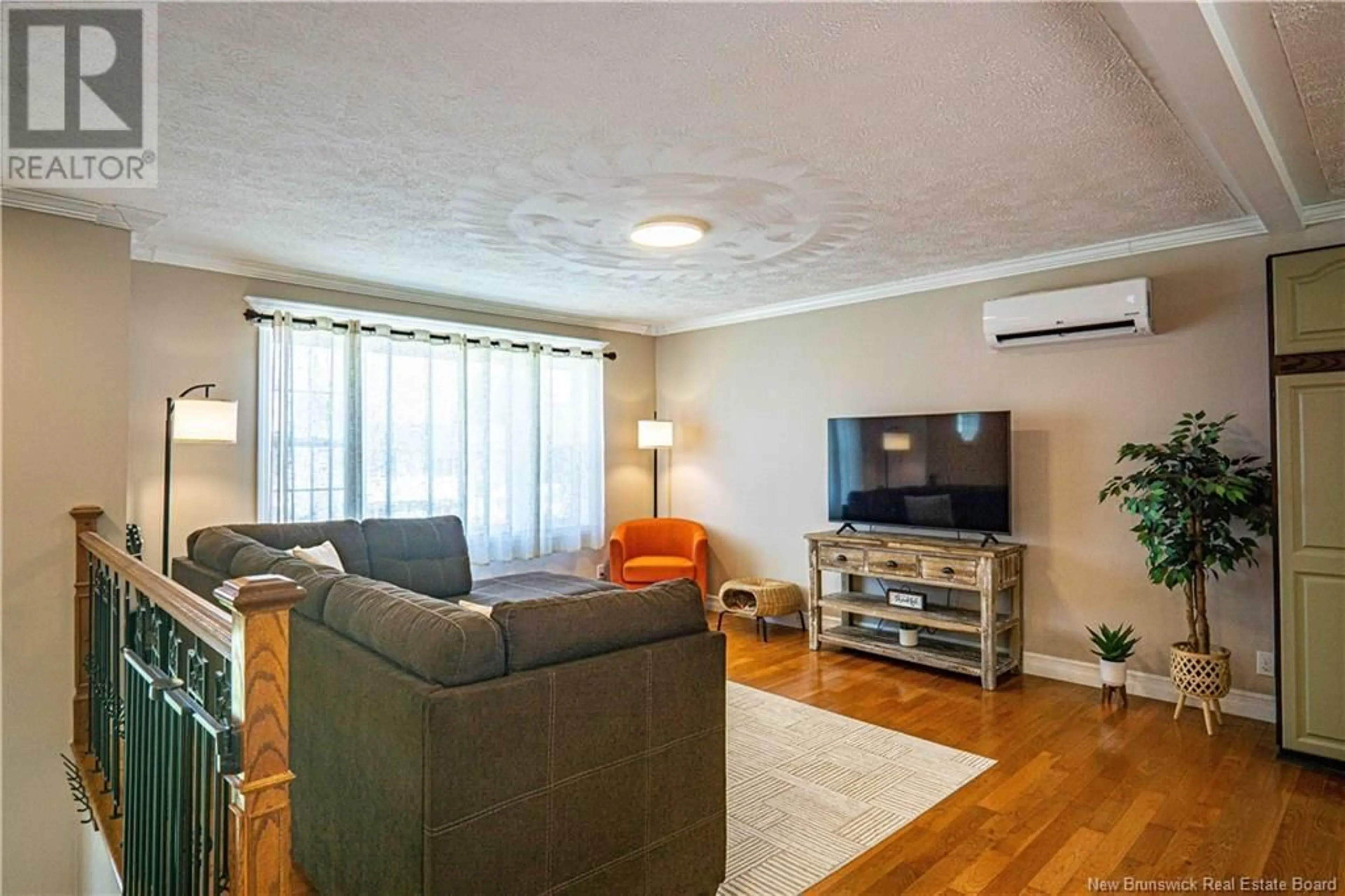 Living room with furniture, wood/laminate floor for 9 LINDSAY LANE, Oromocto New Brunswick E2V2S4