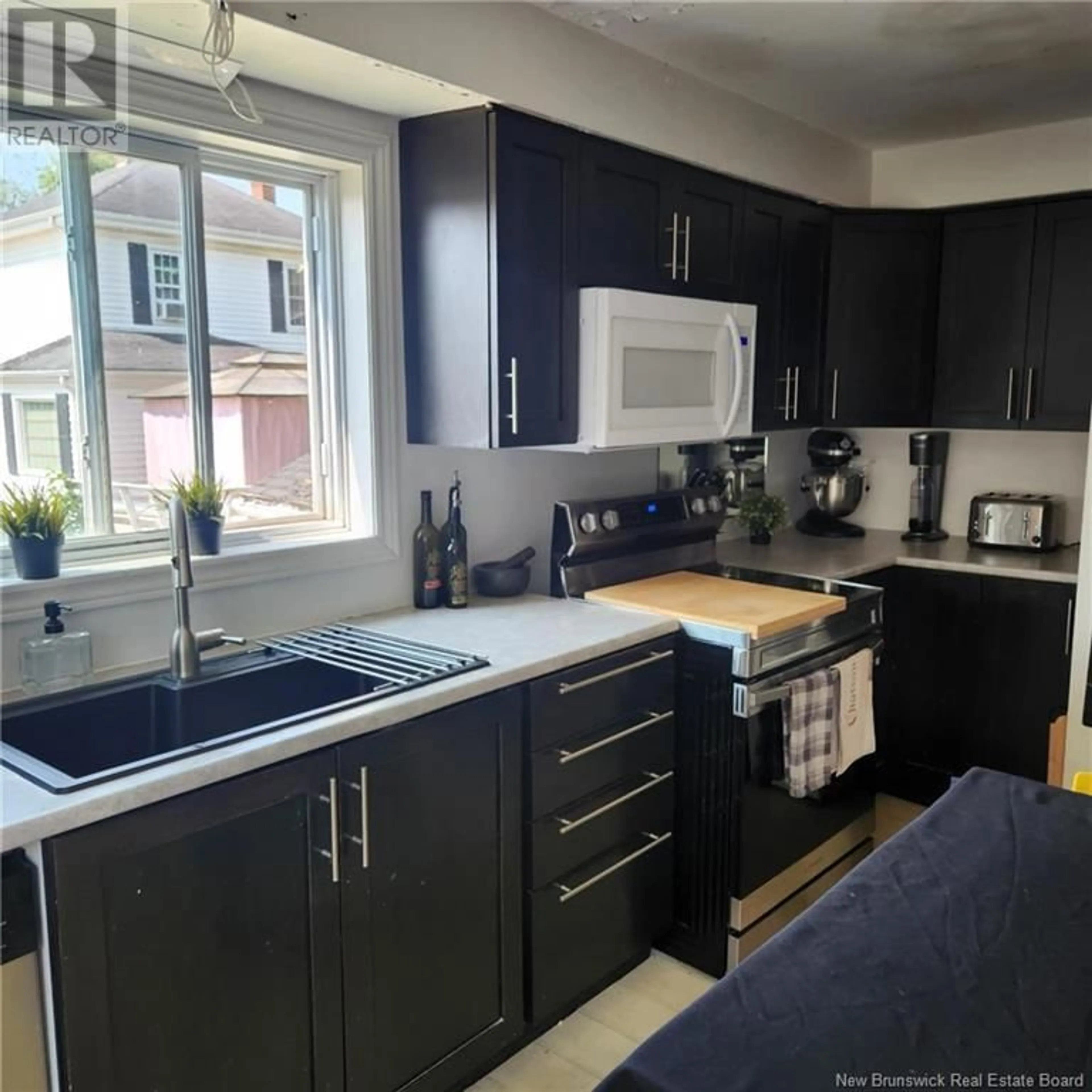 Open concept kitchen, wood/laminate floor for 621 CHARLES STREET, Dieppe New Brunswick E1A1Z5