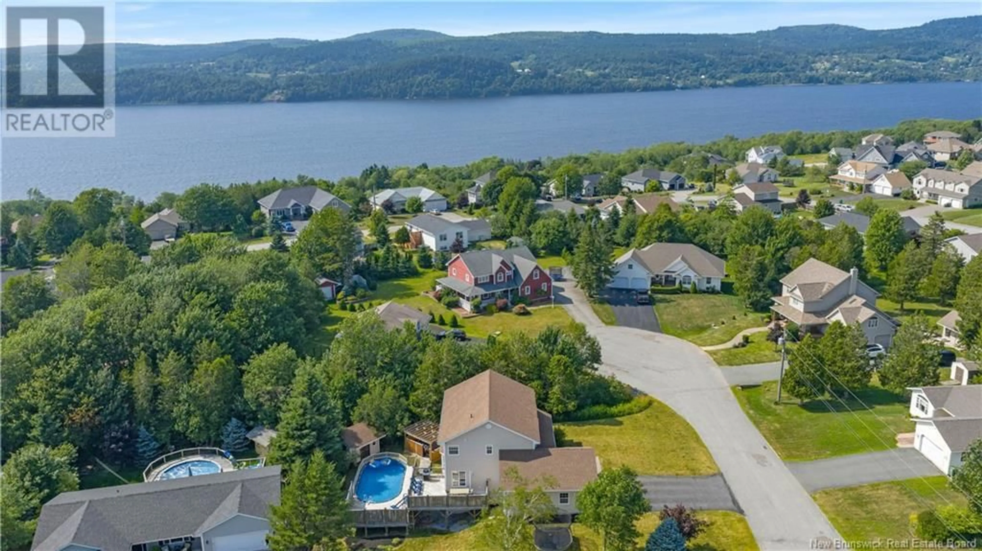 A pic from outside/outdoor area/front of a property/back of a property/a pic from drone, water/lake/river/ocean view for 1 JESTER COURT, Quispamsis New Brunswick E2E5Z9