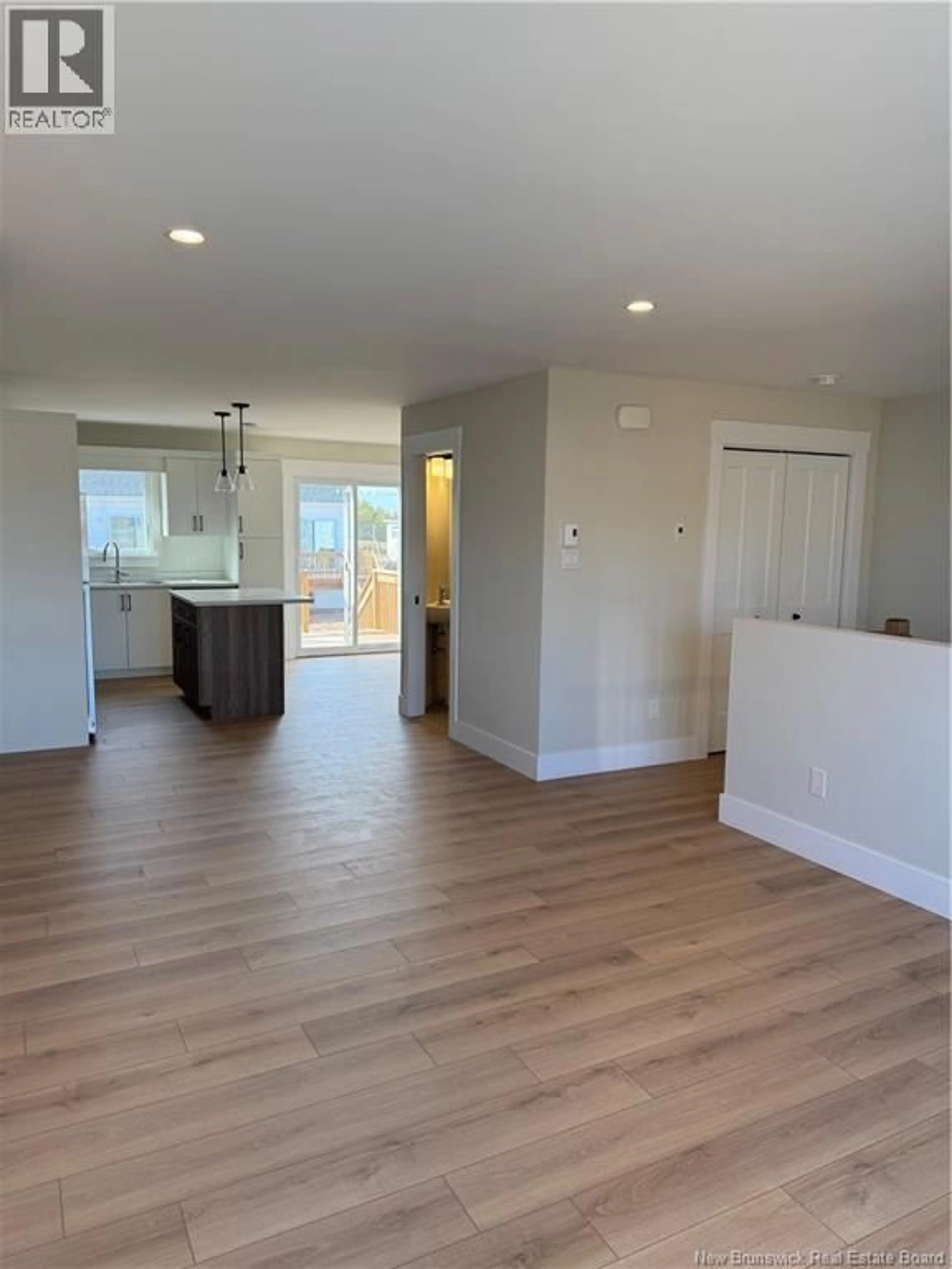 Open concept kitchen, wood/laminate floor for 56 ALOSIER CRESCENT, Moncton New Brunswick E1K0A1