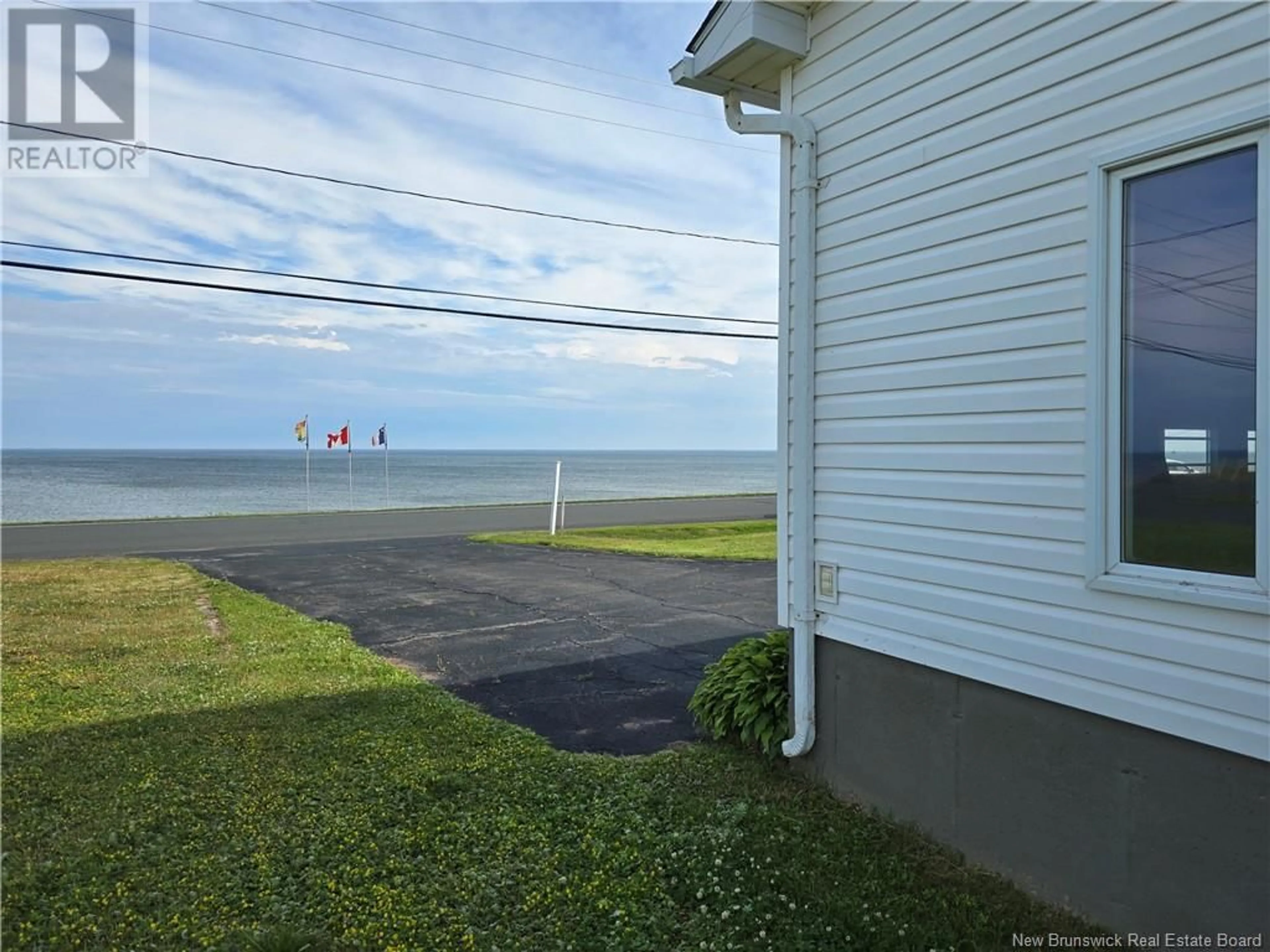 A pic from outside/outdoor area/front of a property/back of a property/a pic from drone, water/lake/river/ocean view for 3163 RTE 305, Pigeon Hill New Brunswick E8T2V7