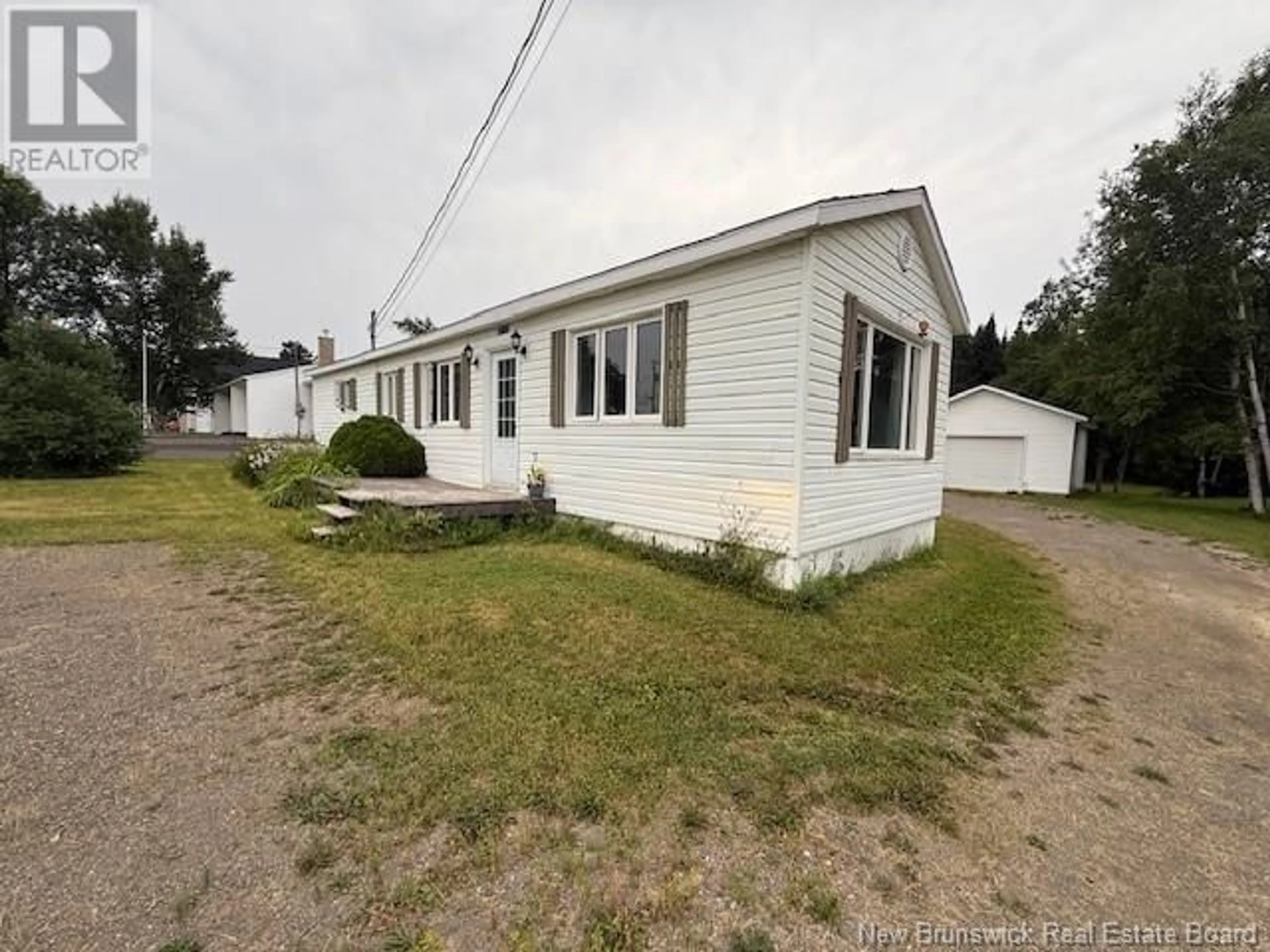 A pic from outside/outdoor area/front of a property/back of a property/a pic from drone, street for 717 DES PIONNIERS AVENUE, Balmoral New Brunswick E8E1B3
