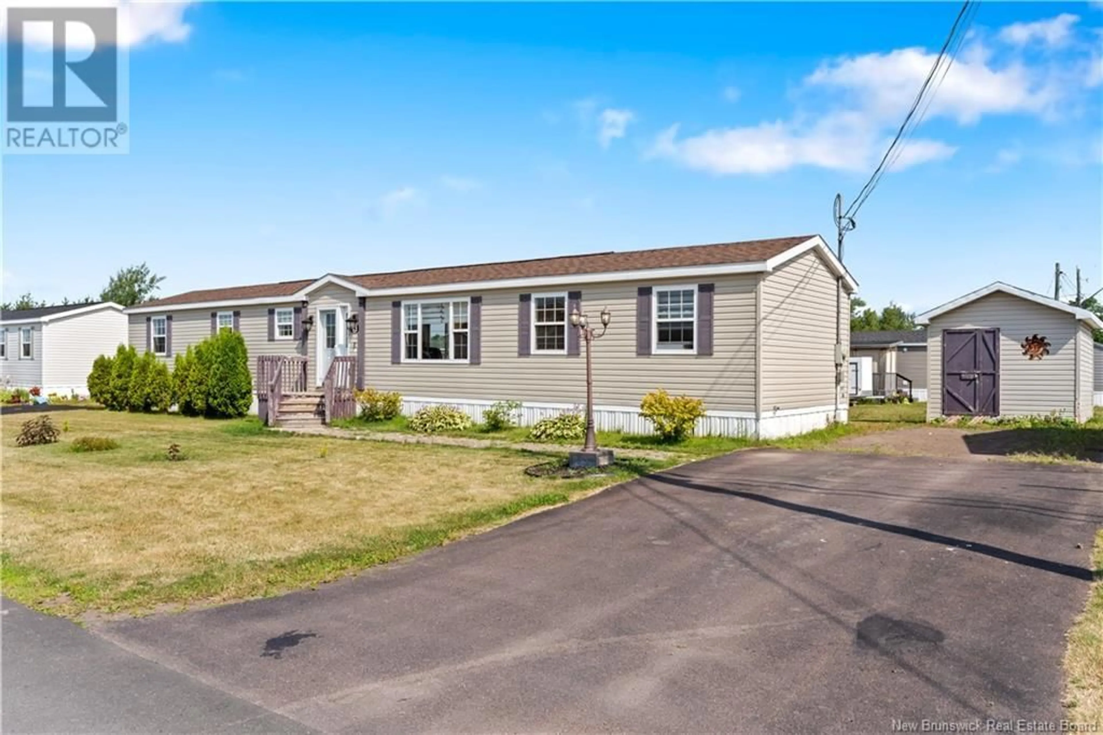 Home with vinyl exterior material, street for 42 TRACADIE DRIVE, Dieppe New Brunswick E1A8P2
