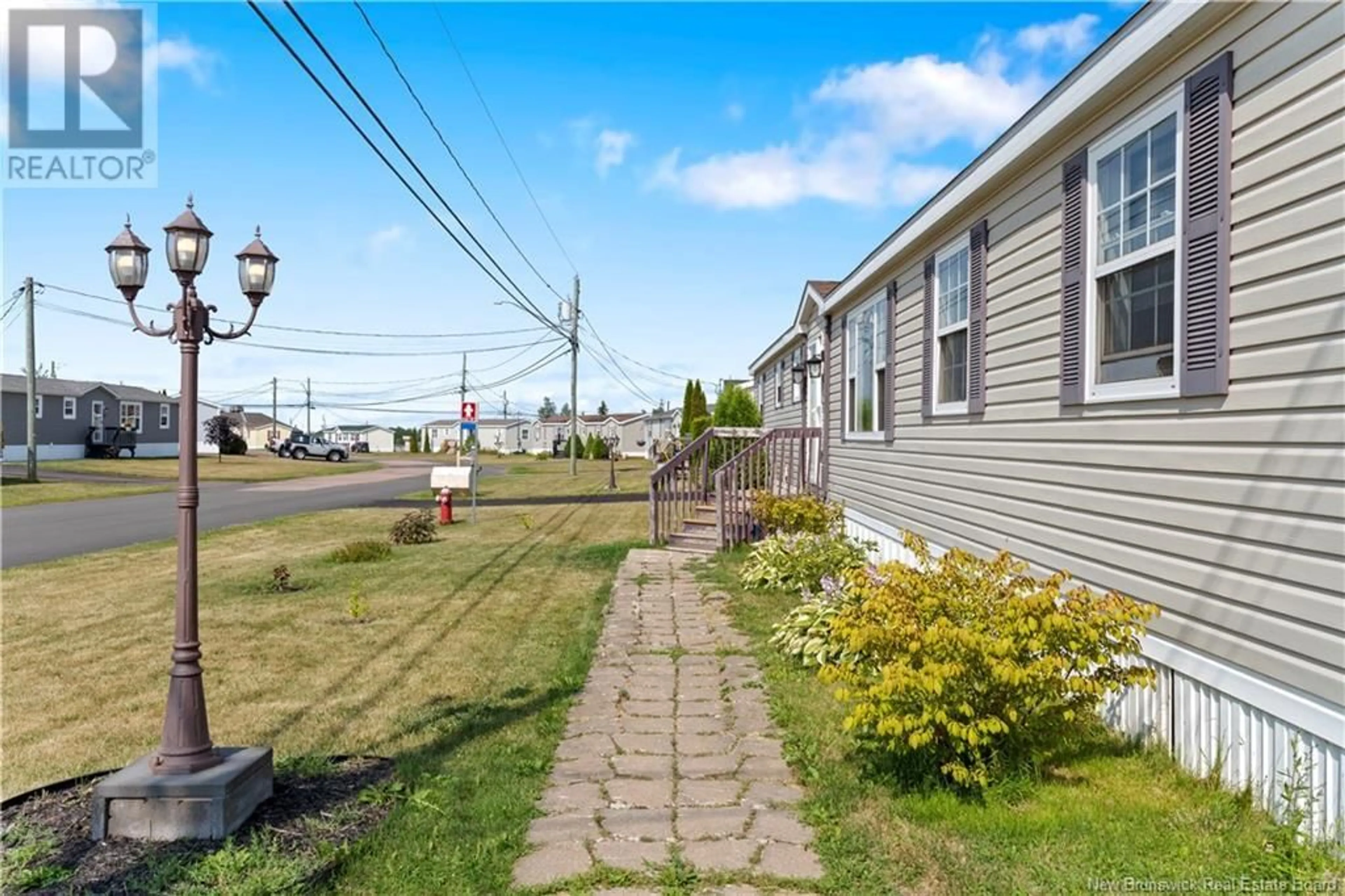 Patio, street for 42 TRACADIE DRIVE, Dieppe New Brunswick E1A8P2
