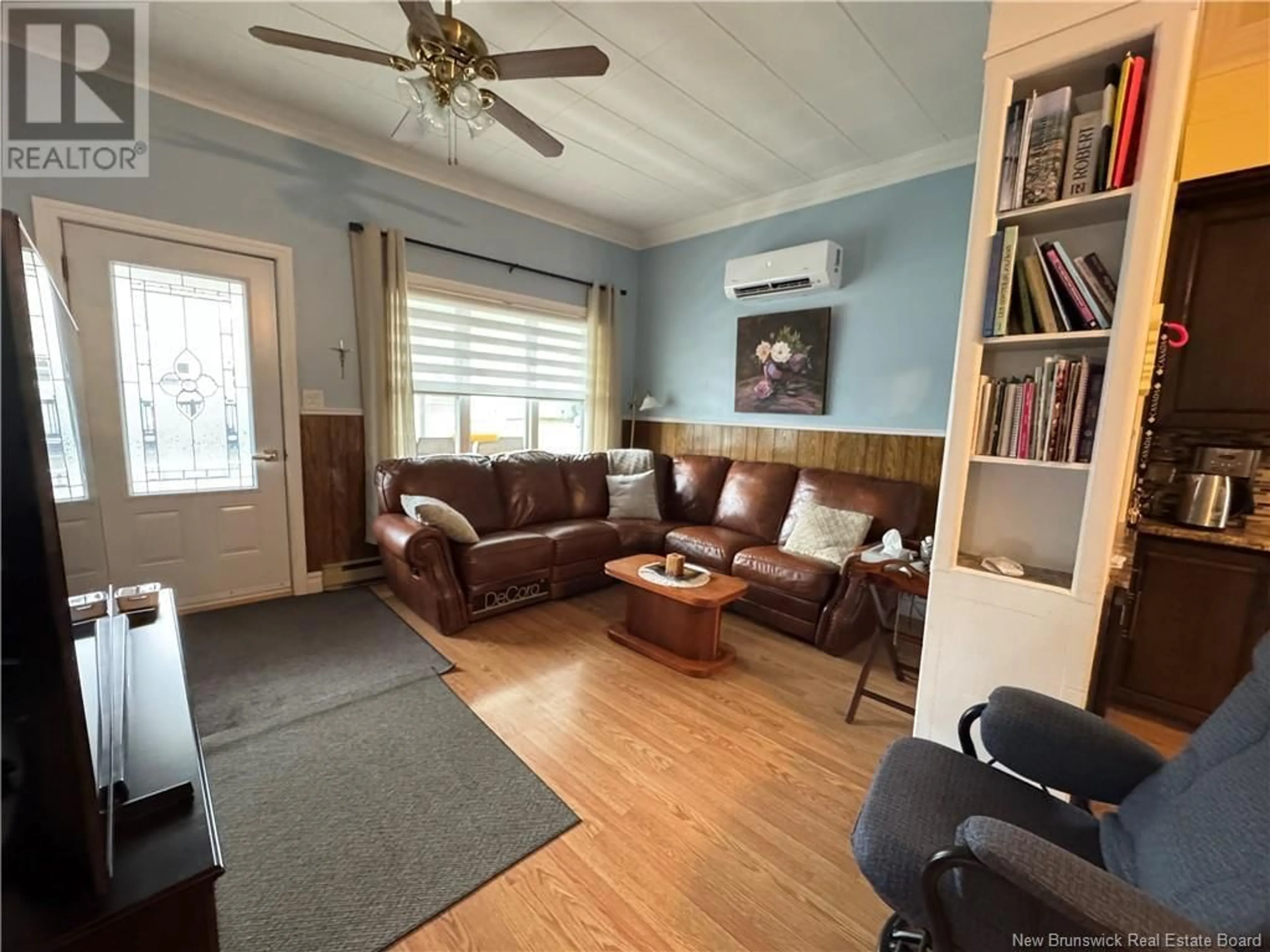 Living room with furniture, wood/laminate floor for 189 CANADA STREET, Saint-Quentin New Brunswick E8A1J8