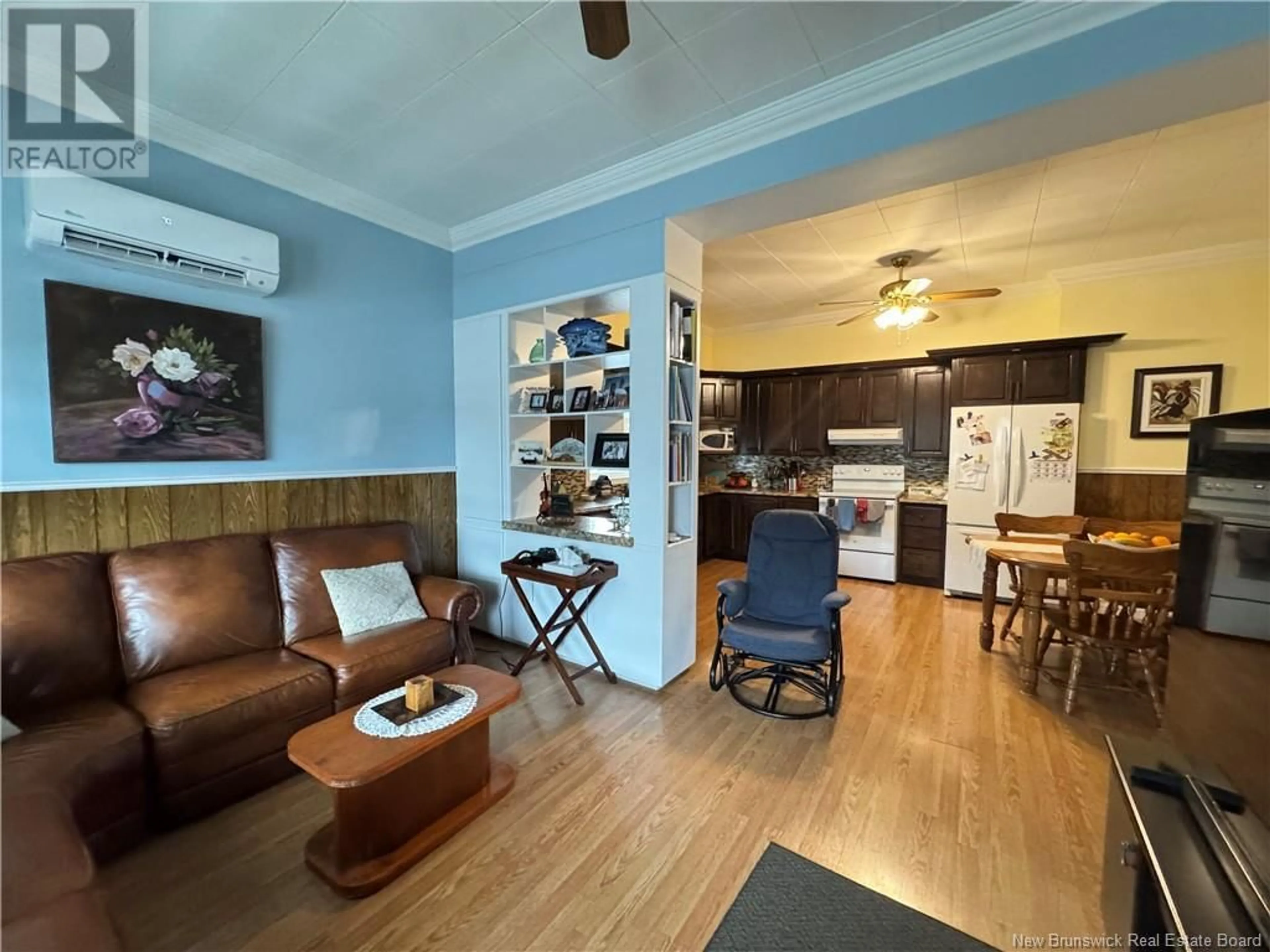 Living room with furniture, wood/laminate floor for 189 CANADA STREET, Saint-Quentin New Brunswick E8A1J8