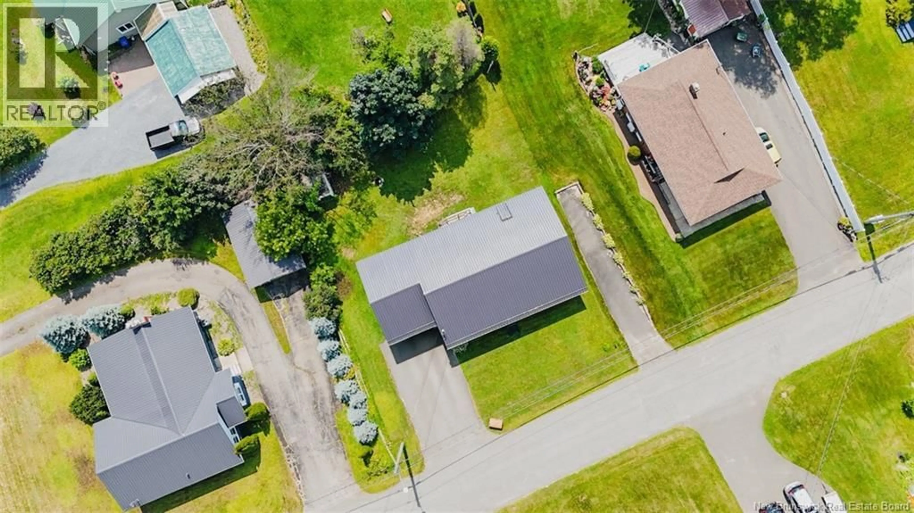 A pic from outside/outdoor area/front of a property/back of a property/a pic from drone, street for 103 STILES STREET, Woodstock New Brunswick E7M2T1