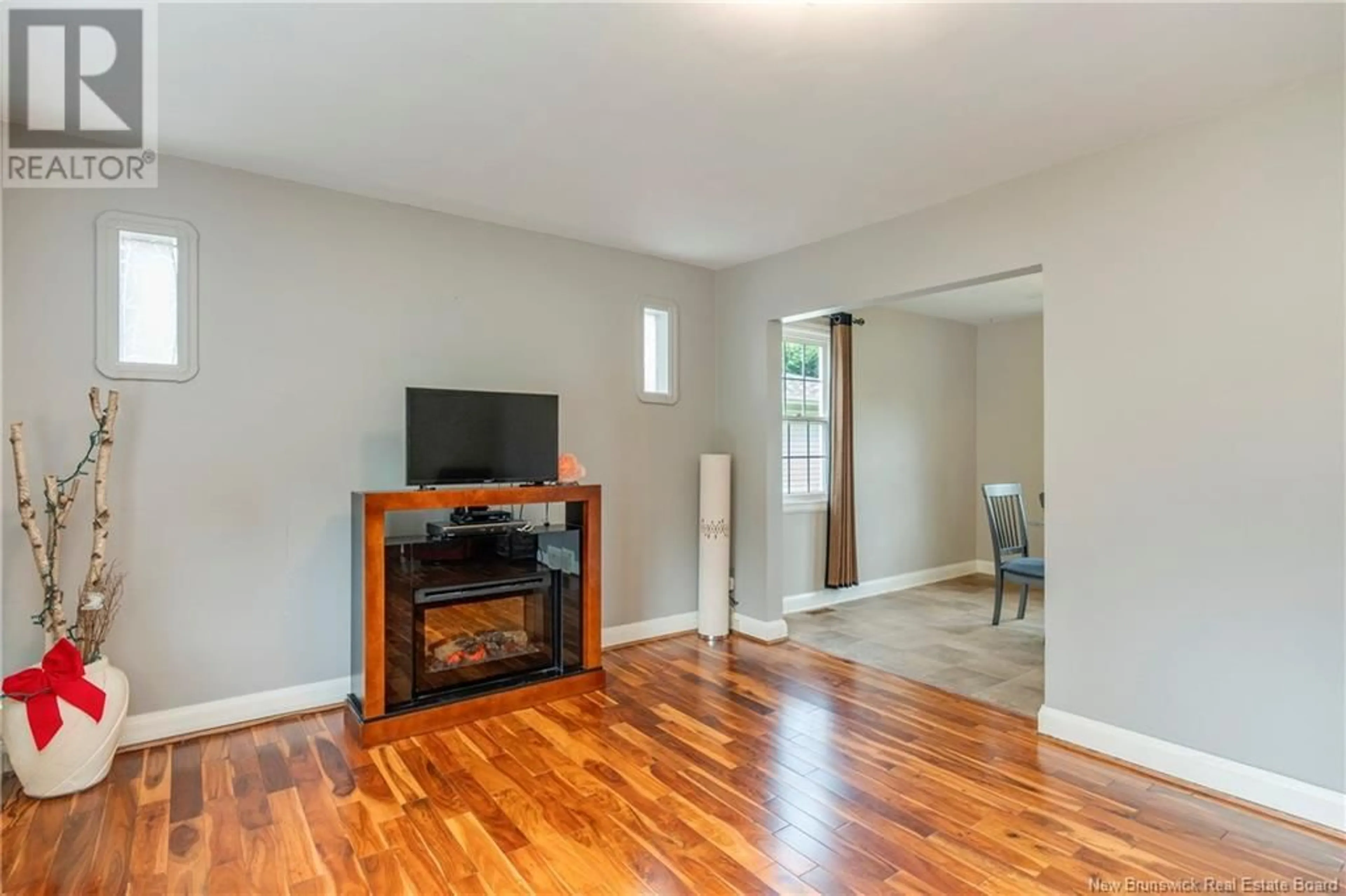 Living room with furniture, wood/laminate floor for 137 READE STREET, Moncton New Brunswick E1C6S4