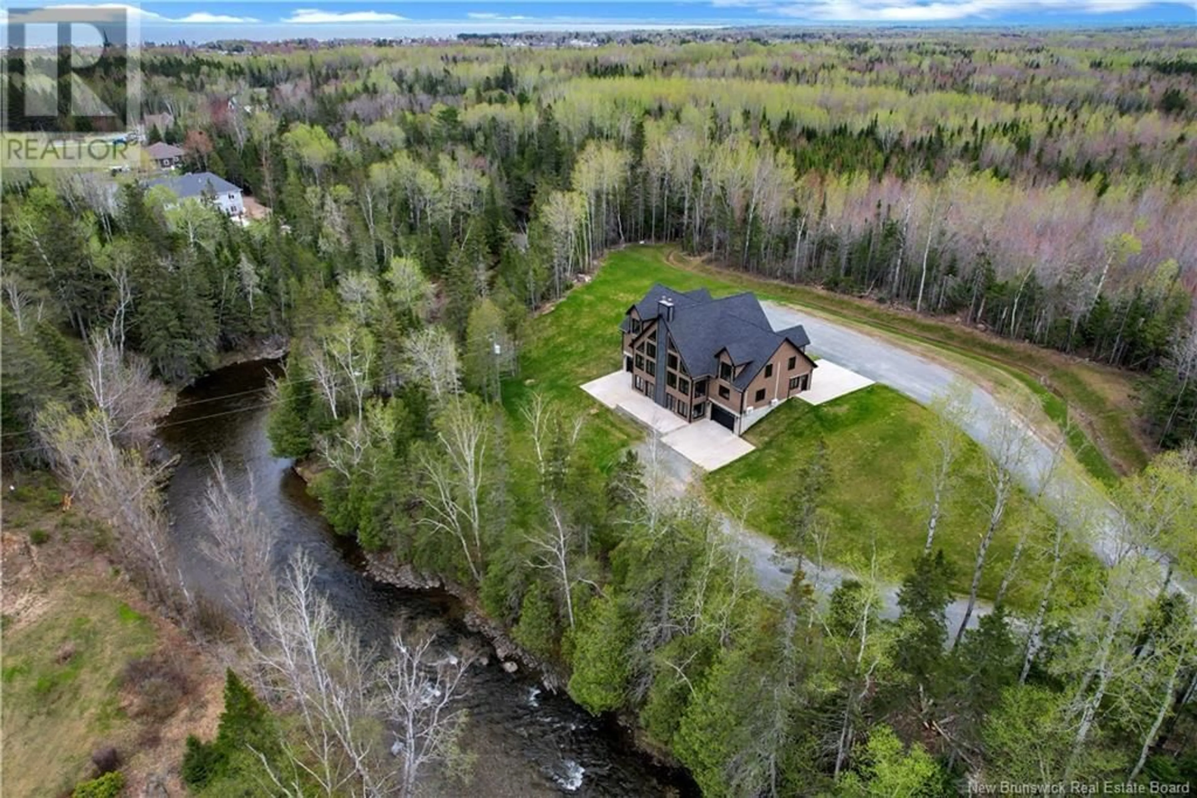 A pic from outside/outdoor area/front of a property/back of a property/a pic from drone, water/lake/river/ocean view for 15 ISRAËL LANE, Beresford New Brunswick E8K0C9