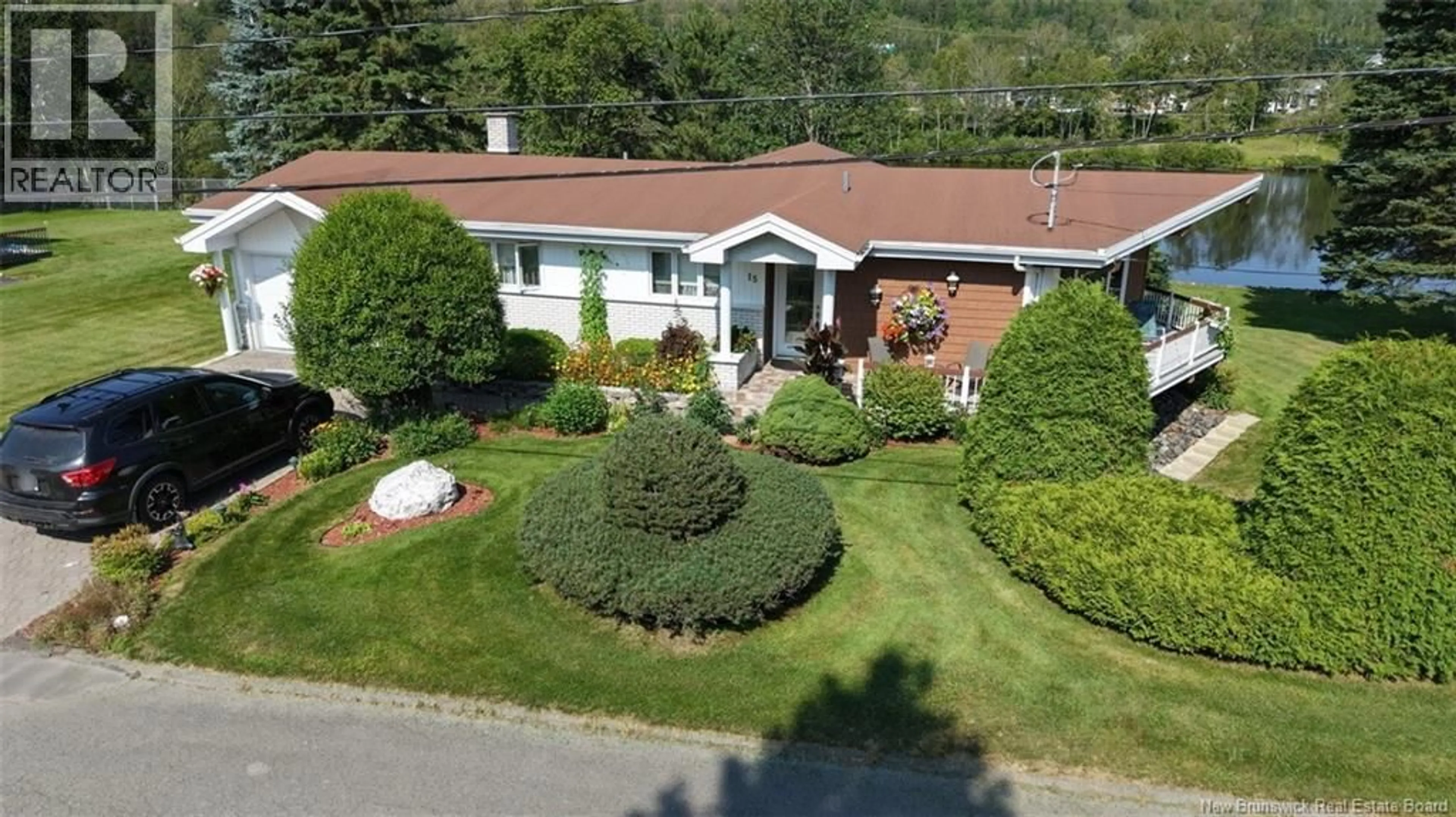 A pic from outside/outdoor area/front of a property/back of a property/a pic from drone, street for 15 LEBLOND STREET, Edmundston New Brunswick E3V4K9