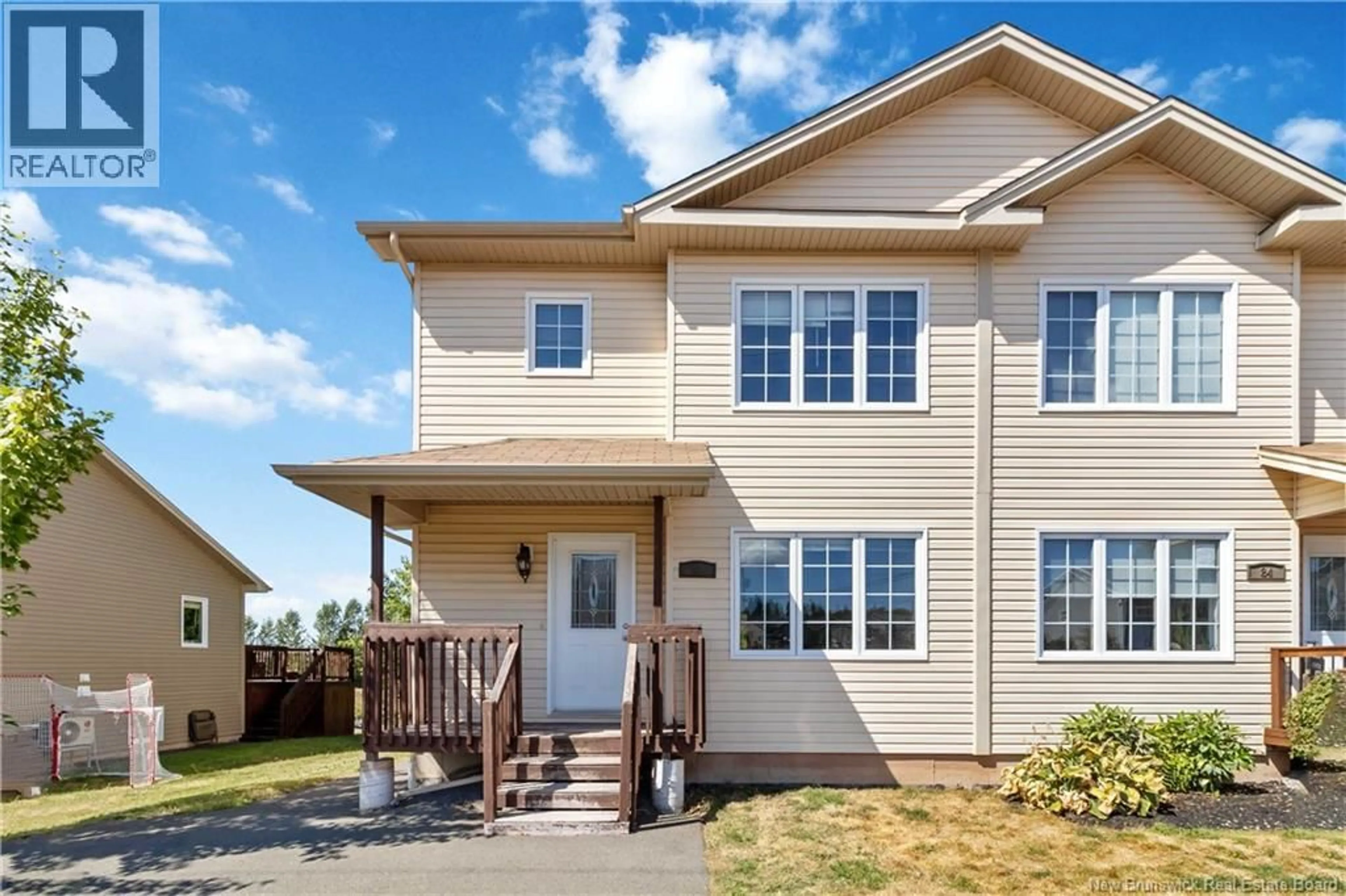 Home with vinyl exterior material, street for 82 BELLE FORET, Dieppe New Brunswick E1A7M7