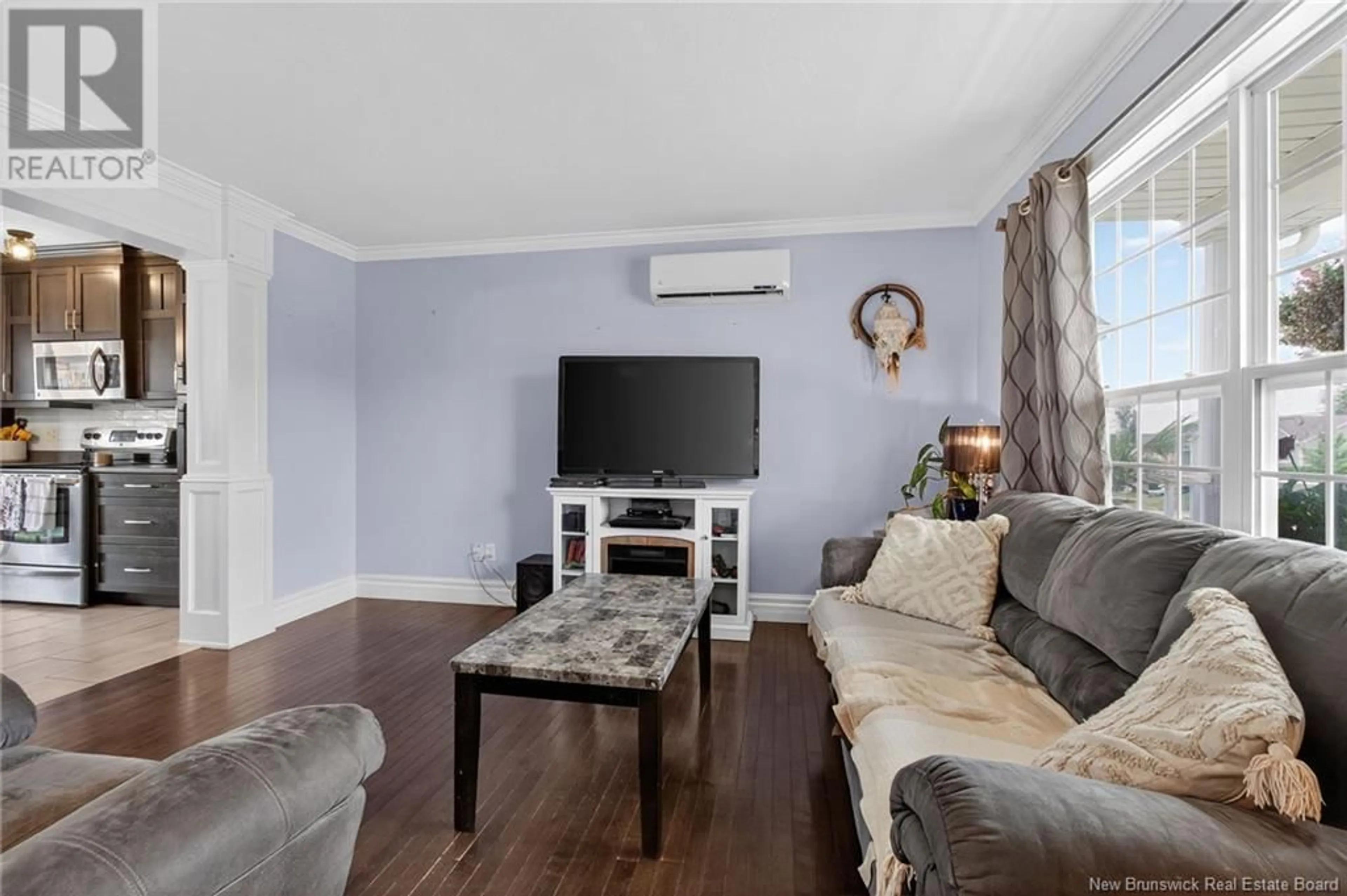 Living room with furniture, wood/laminate floor for 51 LADY RUSSELL STREET, Moncton New Brunswick E1E0C4