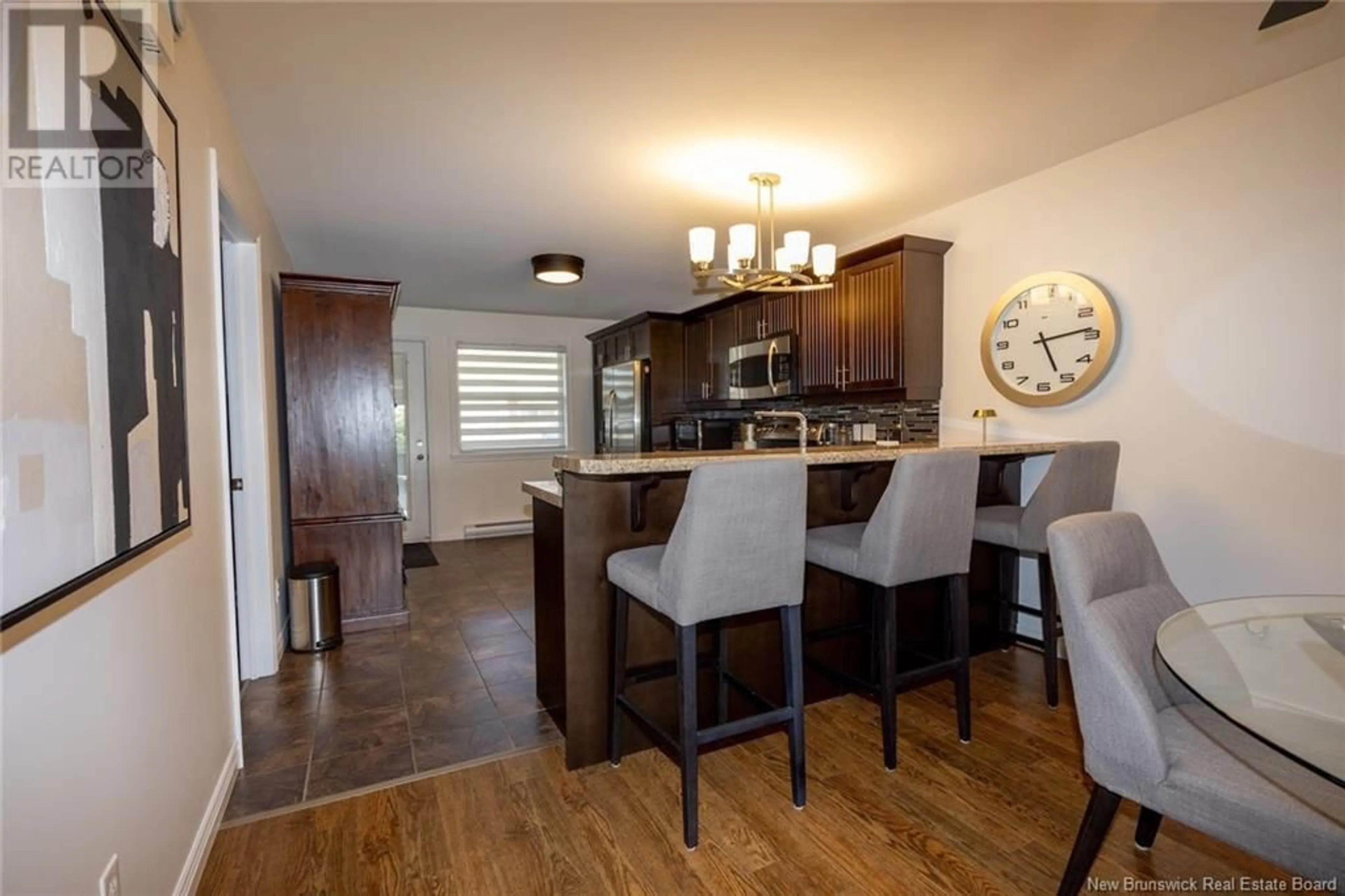 Open concept kitchen, wood/laminate floor for 35 - 20 TRAILSIDE LANE, Fredericton New Brunswick E3A1R7