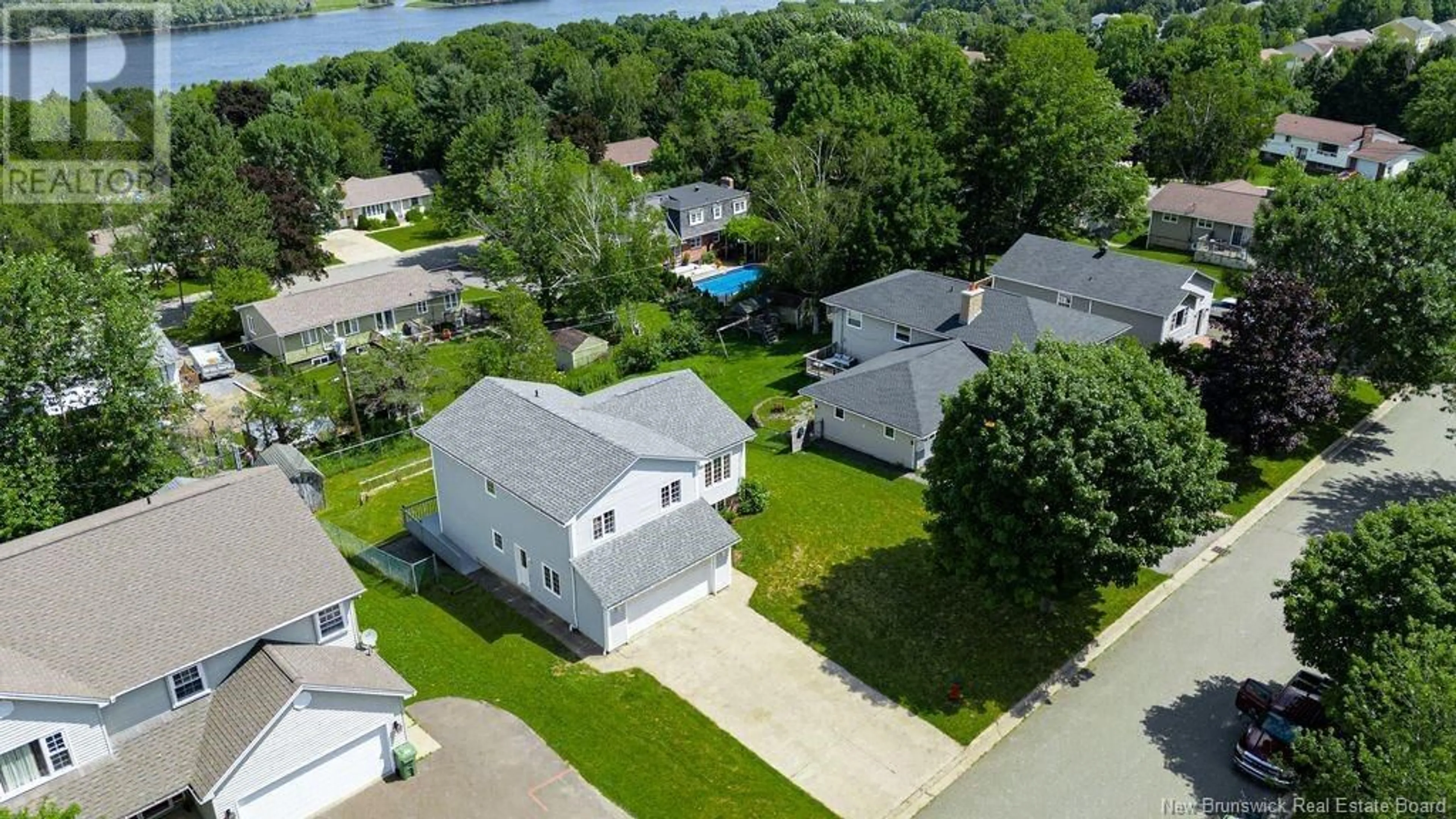 A pic from outside/outdoor area/front of a property/back of a property/a pic from drone, water/lake/river/ocean view for 39 AMBERWOOD LANE, Fredericton New Brunswick E3C1L7