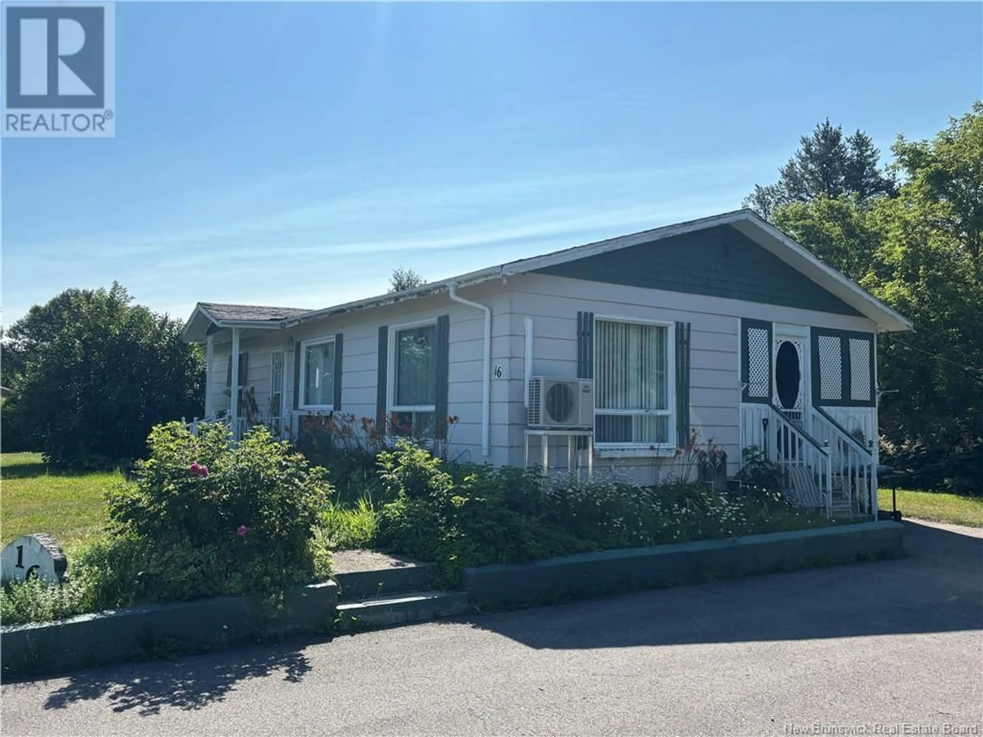 Home with vinyl exterior material, street for 16 RUE BERTIN, Sainte-Anne New Brunswick E2A7B2