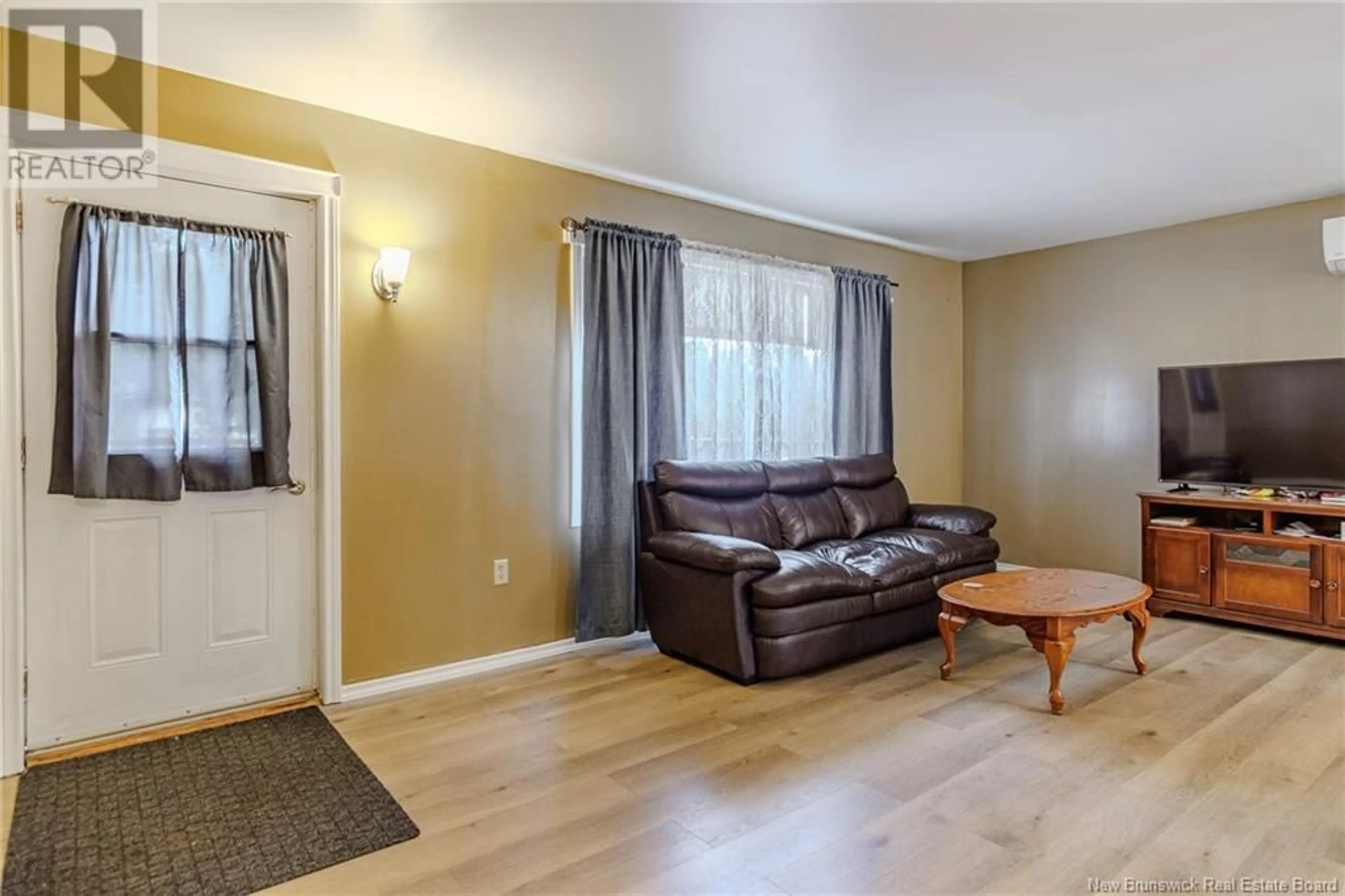 Living room with furniture, wood/laminate floor for 42 BALL PARK ROAD, Rothesay New Brunswick E2E2B7
