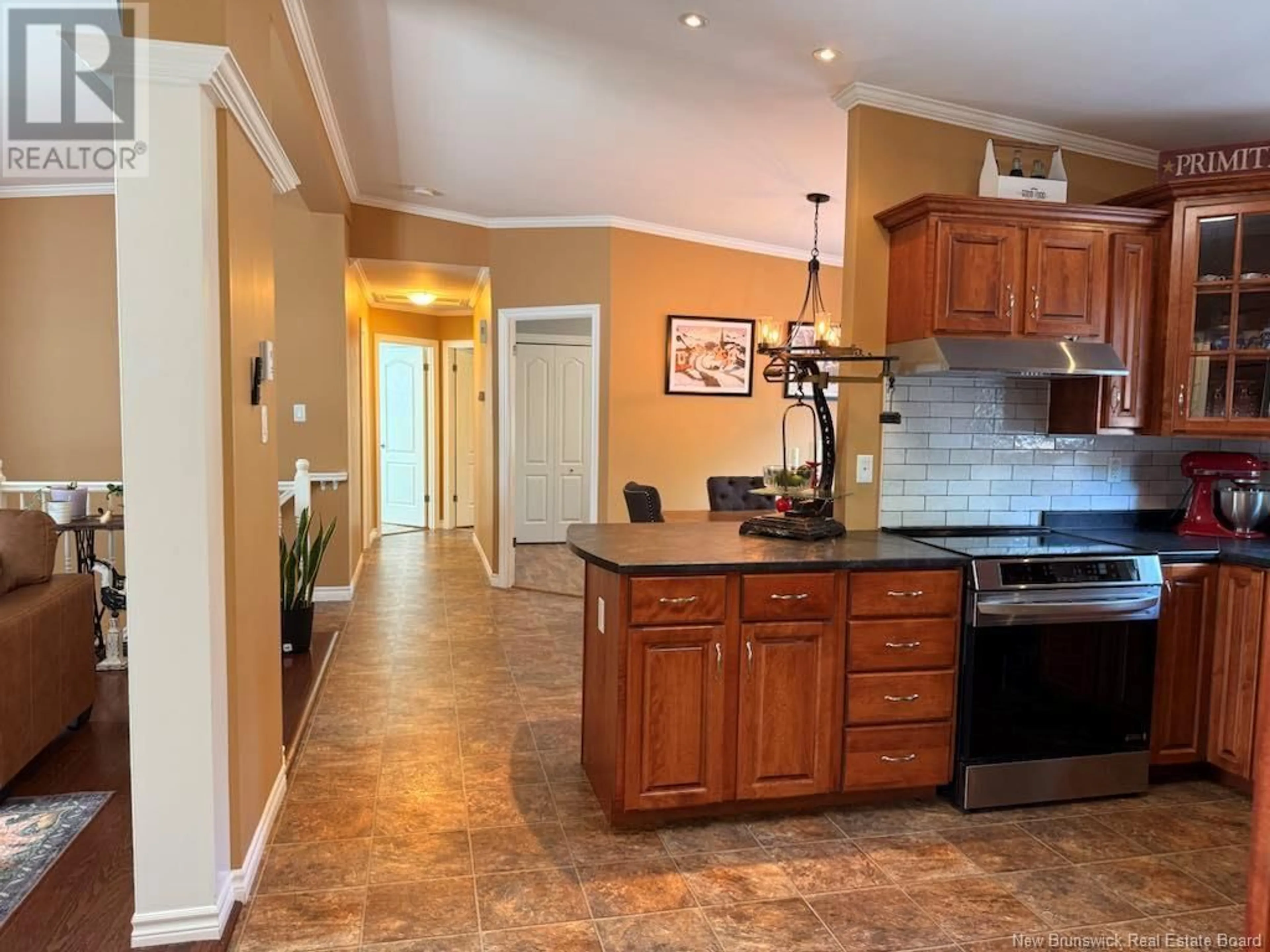 Open concept kitchen, ceramic/tile floor for 16 DINAN STREET, Miramichi New Brunswick E1V0B5