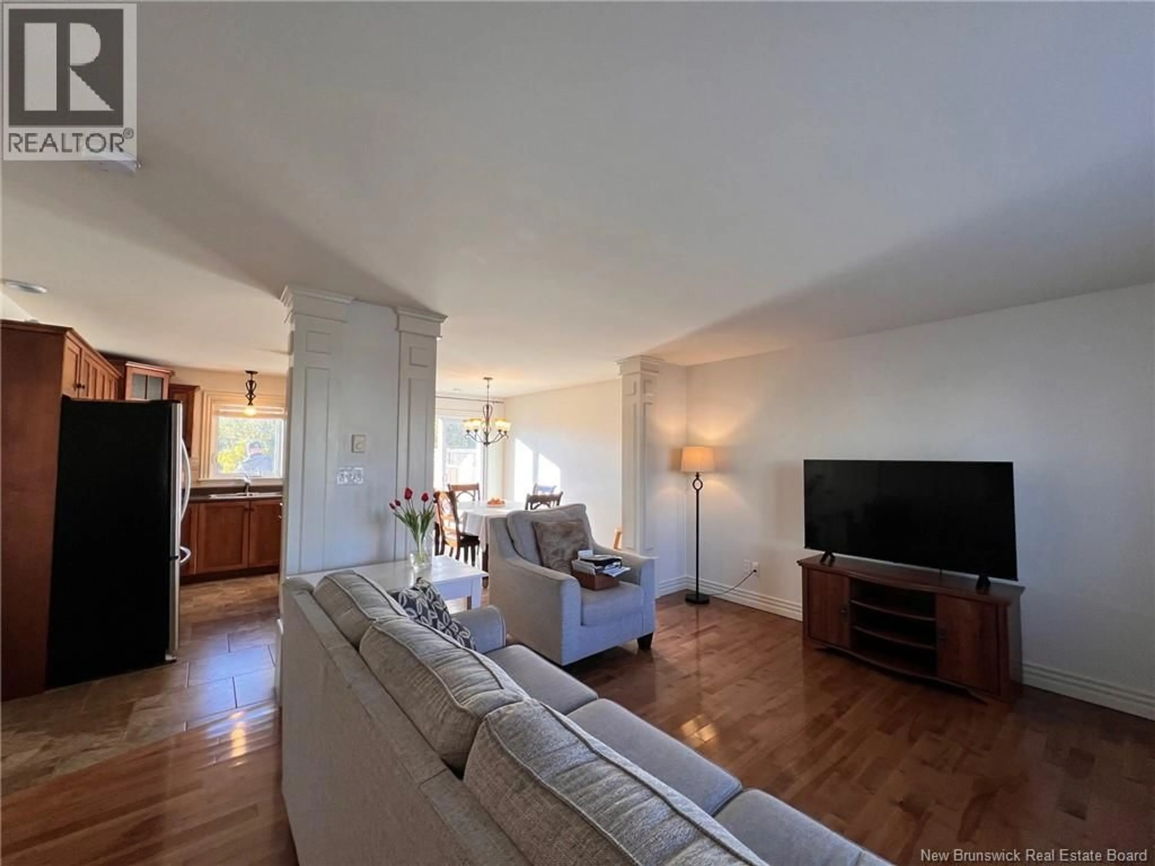Living room with furniture, wood/laminate floor for 50 NUGENT STREET, Dieppe New Brunswick E1A0S6