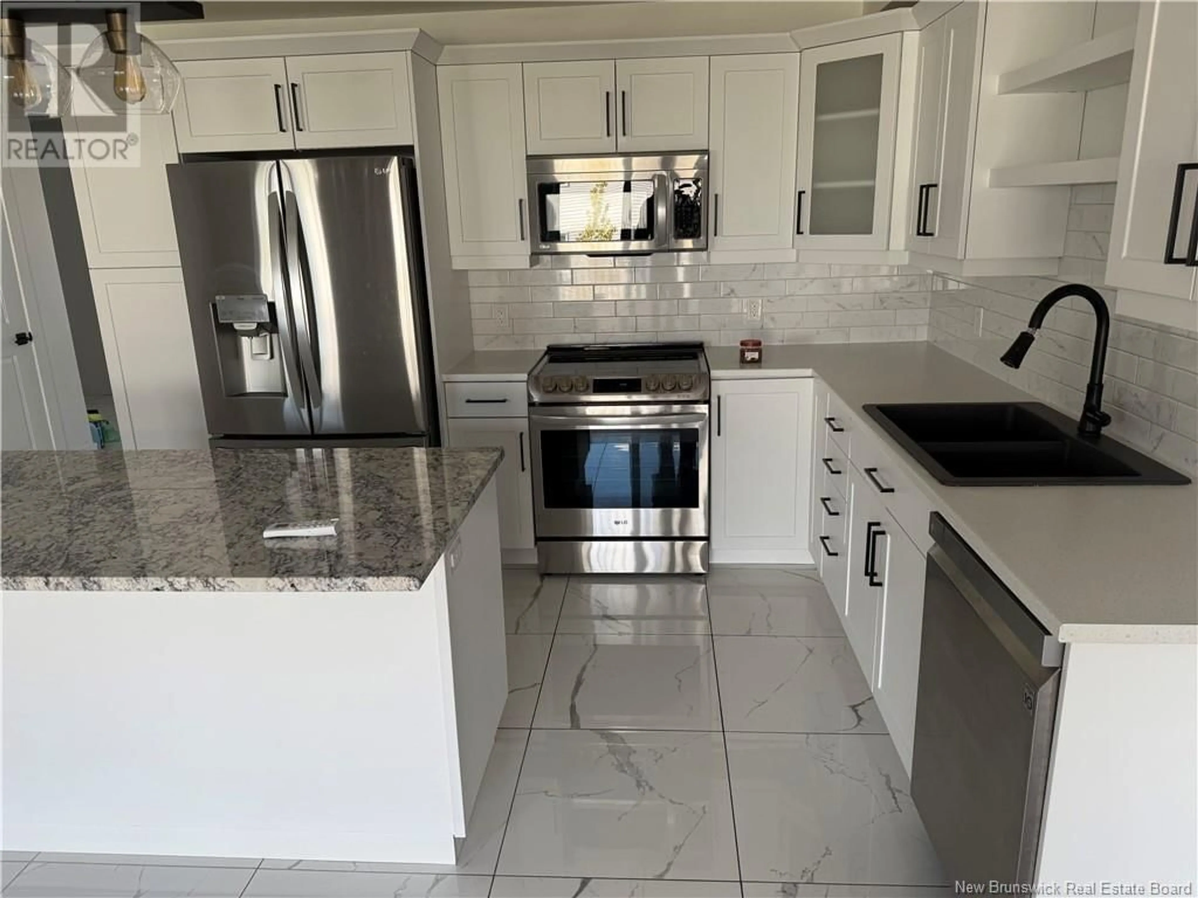 Open concept kitchen, ceramic/tile floor for 75 WARNER STREET, Moncton New Brunswick E1A5T3