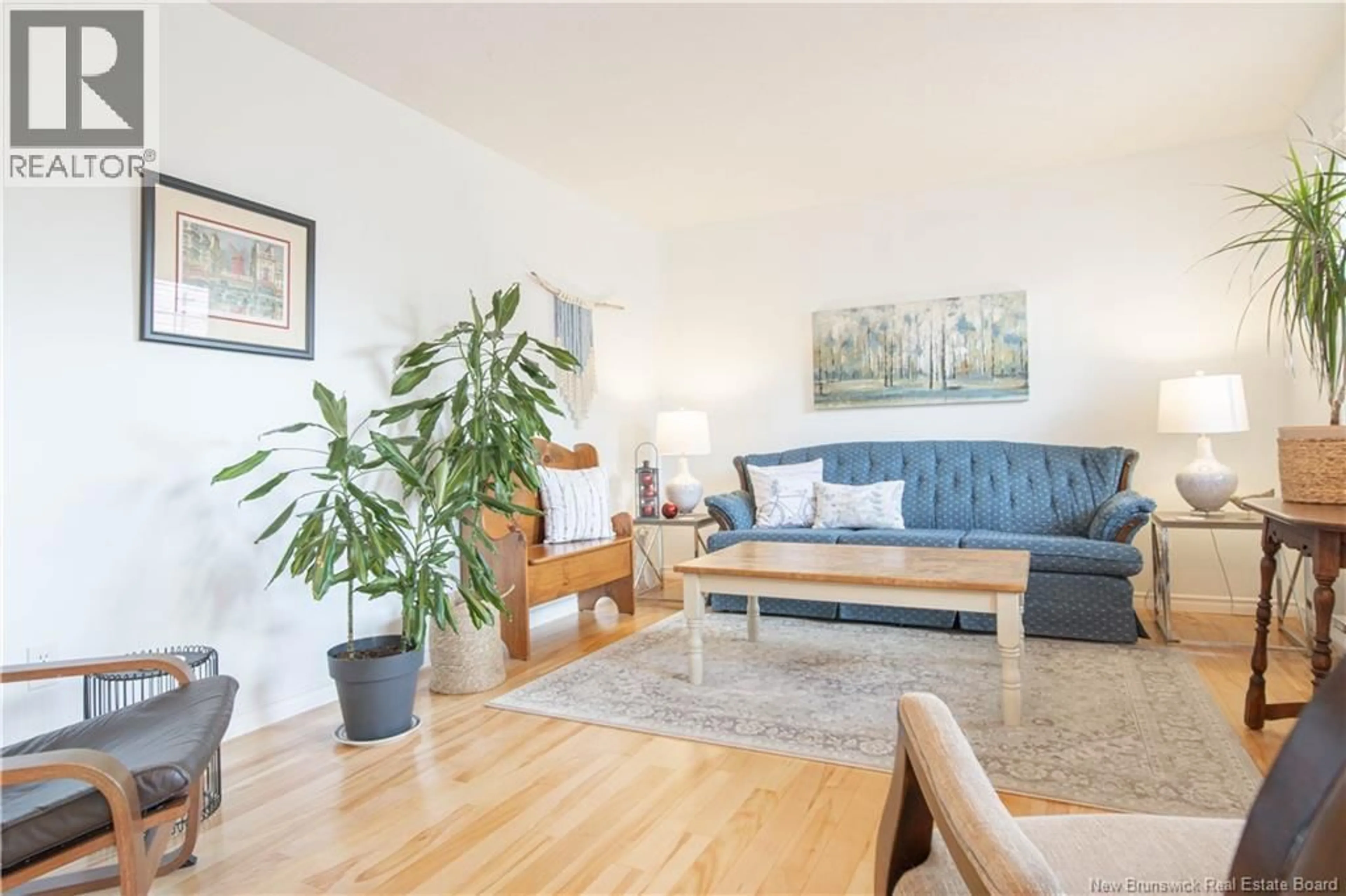 Living room with furniture, wood/laminate floor for 11 BRIDLEWOOD WAY, Moncton New Brunswick E1G2H2