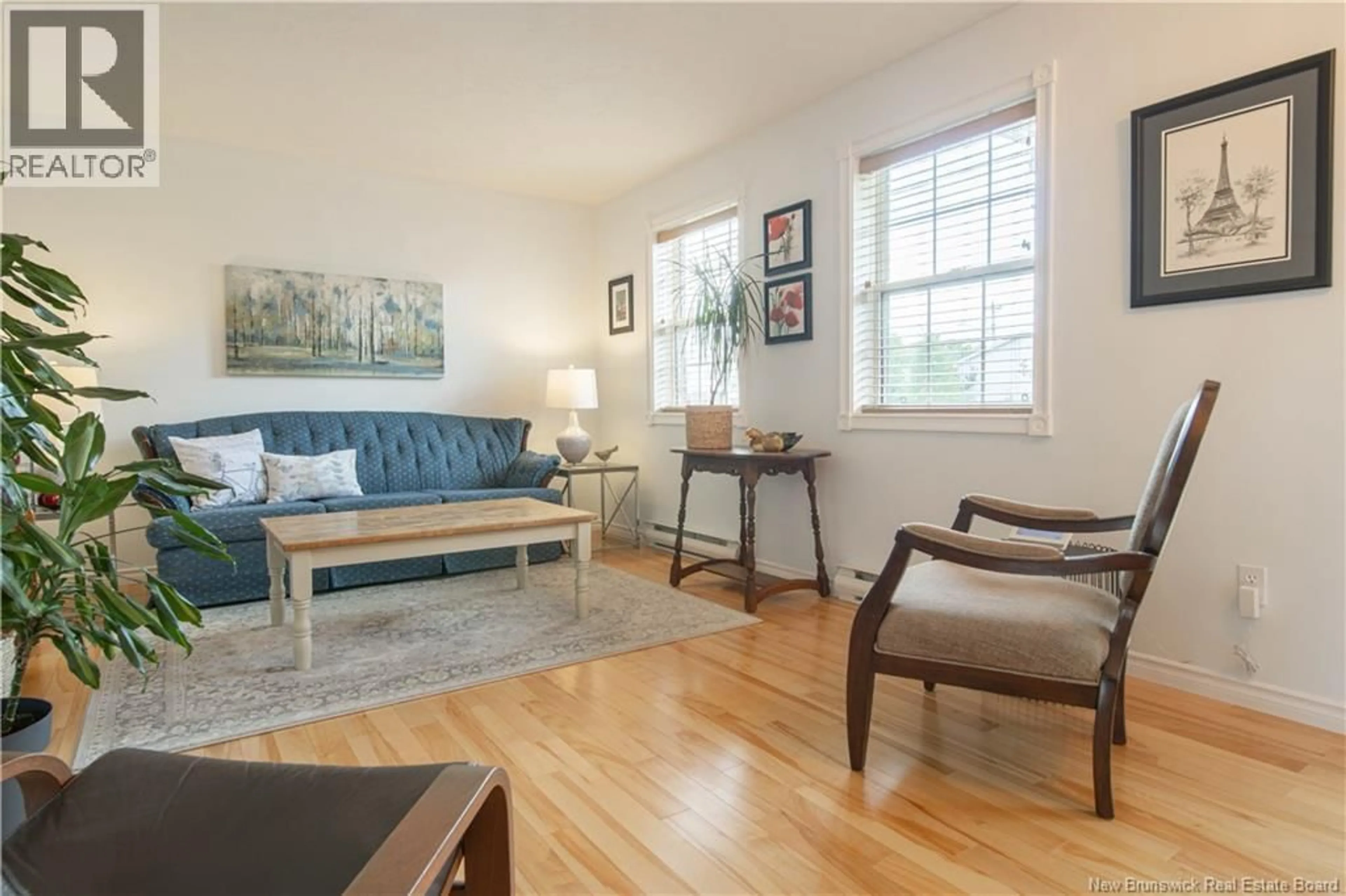 Living room with furniture, wood/laminate floor for 11 BRIDLEWOOD WAY, Moncton New Brunswick E1G2H2