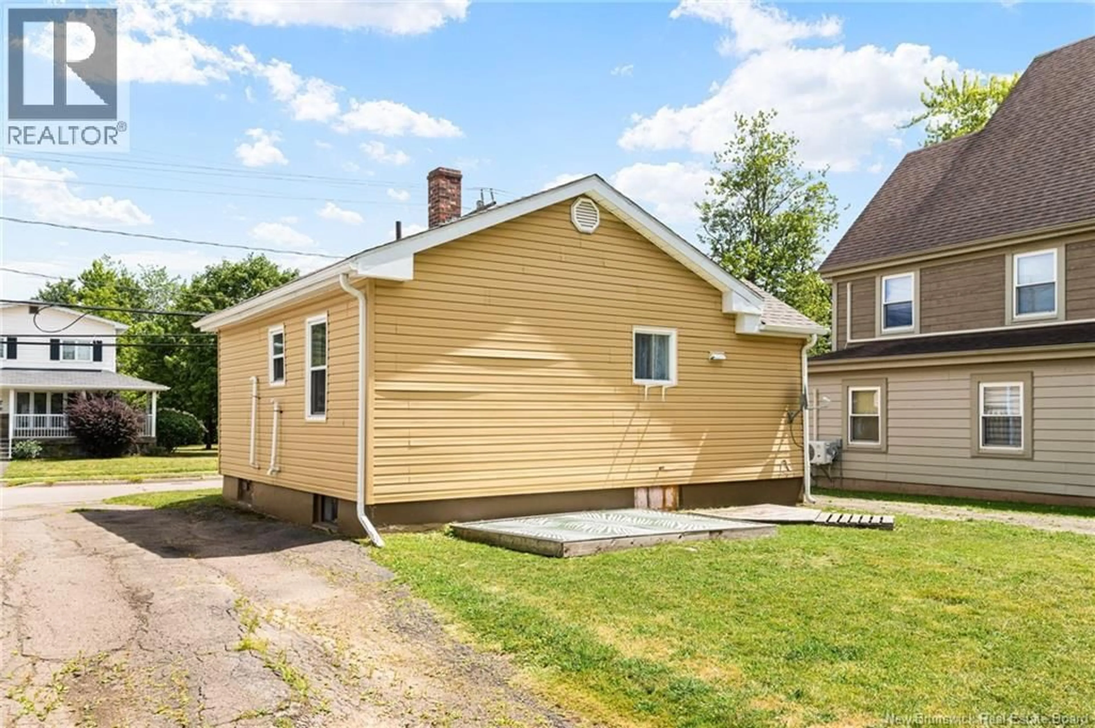 Home with vinyl exterior material, street for 98 MCSWEENEY AVENUE, Moncton New Brunswick E1C7C8