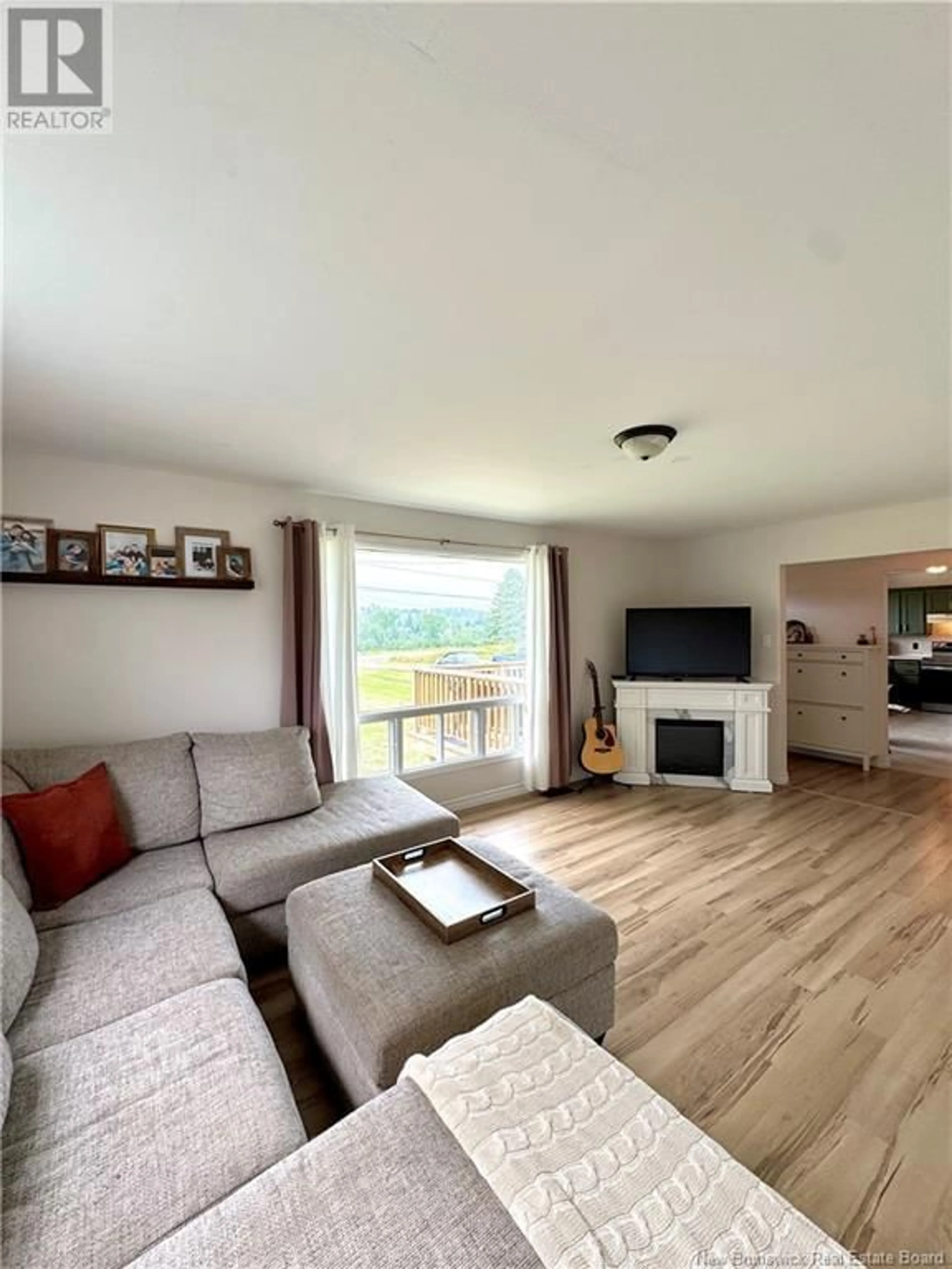 Living room with furniture, wood/laminate floor for 523 BARNABY ROAD, Miramichi New Brunswick E1N6E9