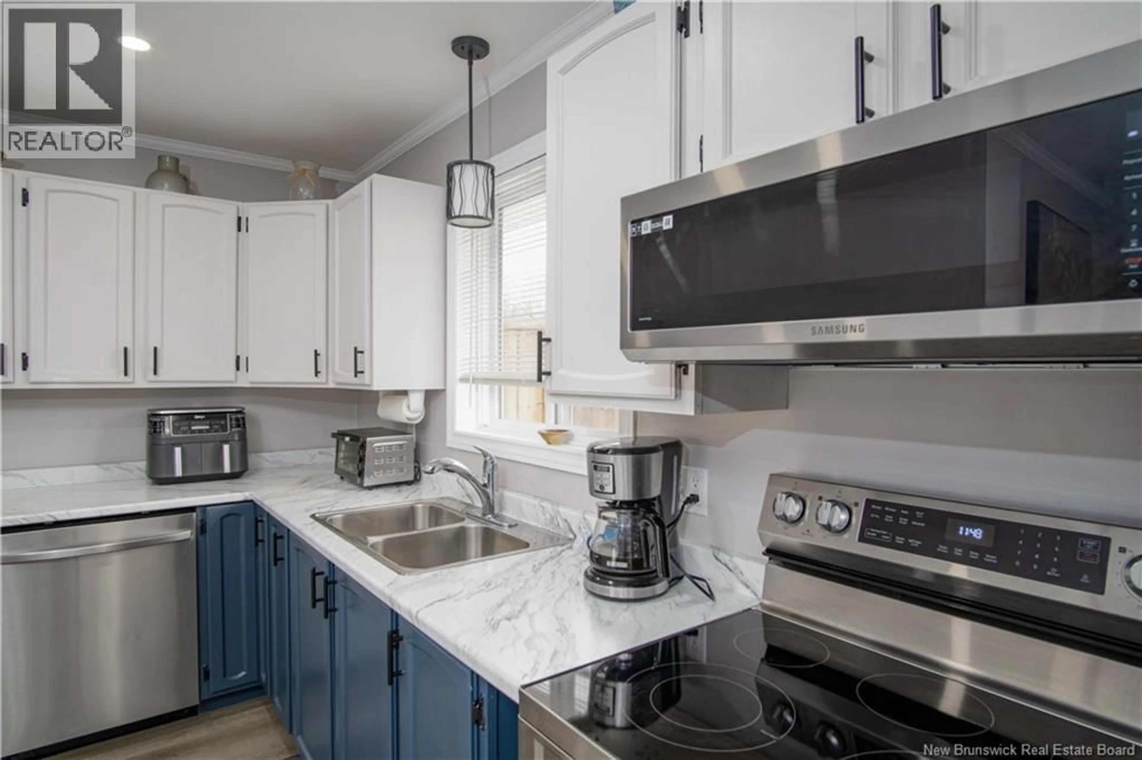 Open concept kitchen, ceramic/tile floor for 18 DALILA COURT, Saint John New Brunswick E2M5P9