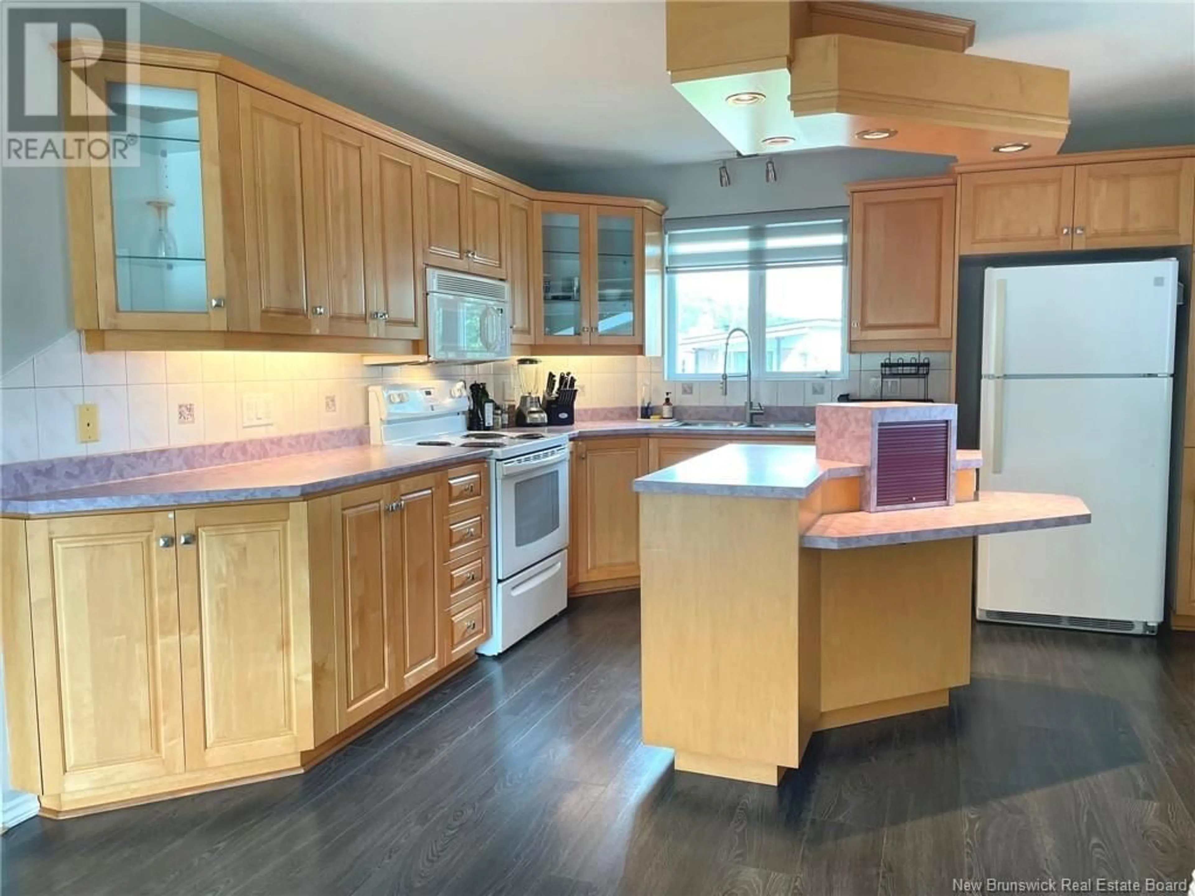 Open concept kitchen, wood/laminate floor for 280 DU POUVOIR ROAD, Edmundston New Brunswick E3V2Y7