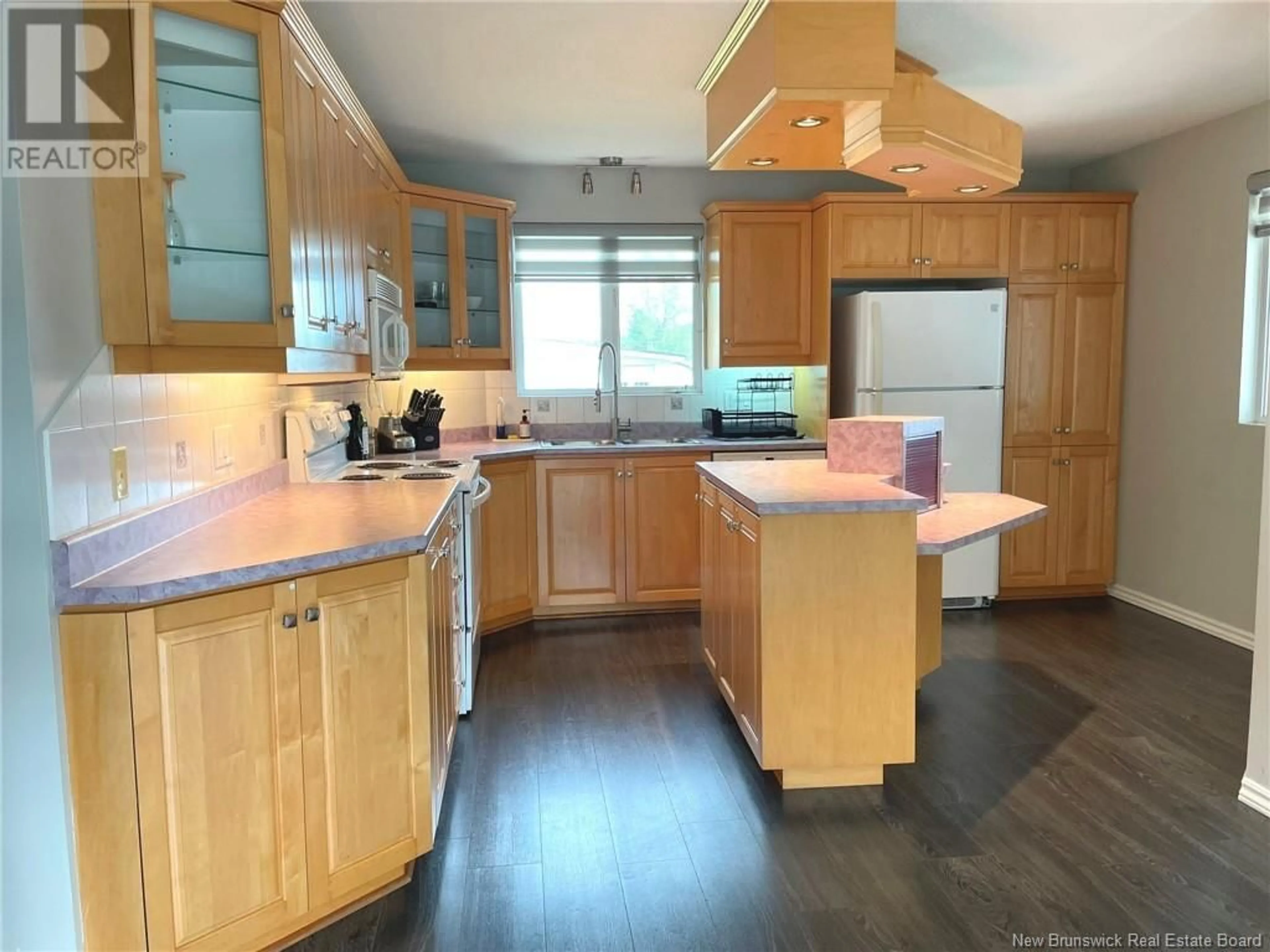 Open concept kitchen, wood/laminate floor for 280 DU POUVOIR ROAD, Edmundston New Brunswick E3V2Y7