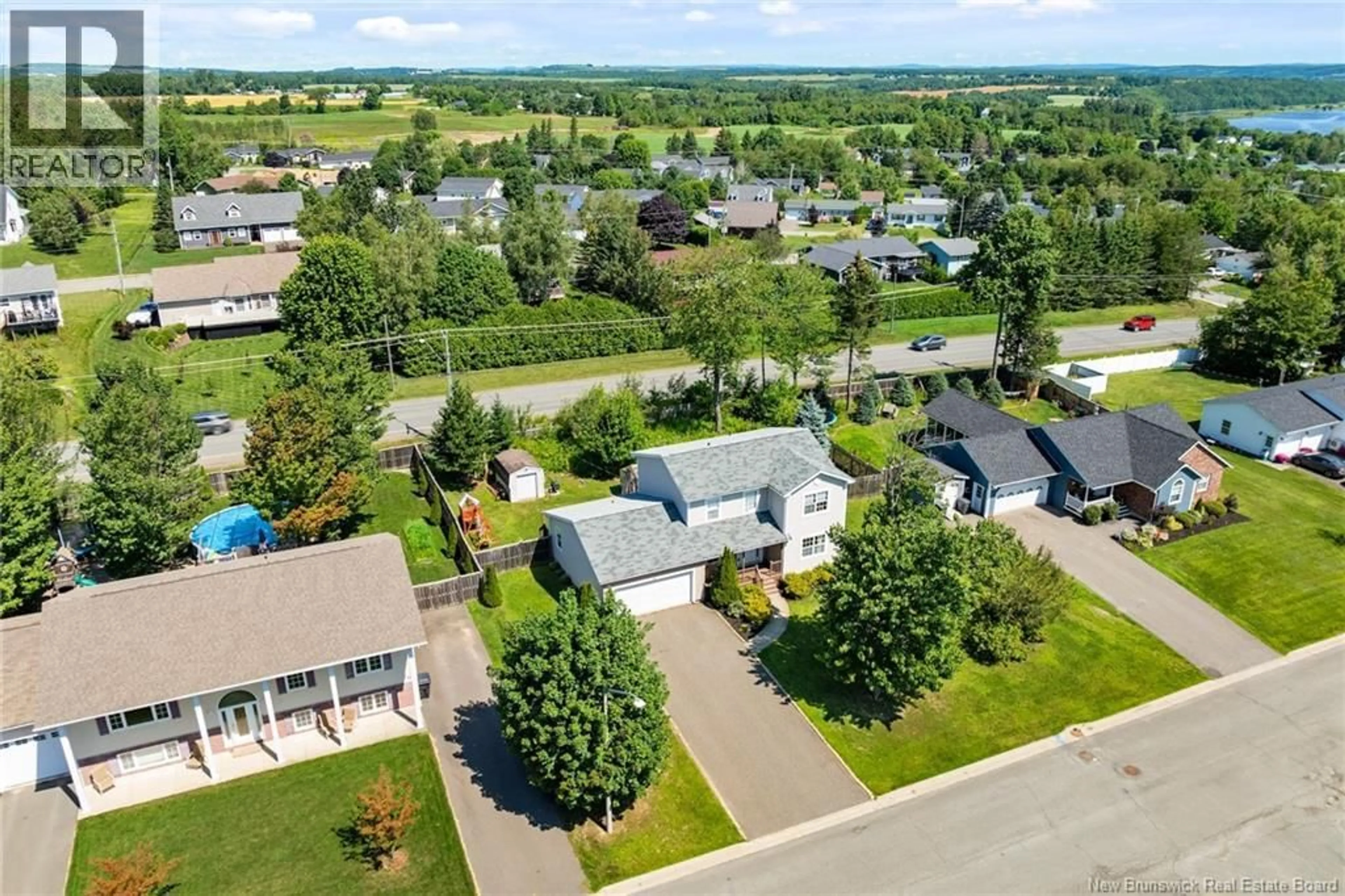 A pic from outside/outdoor area/front of a property/back of a property/a pic from drone, street for 86 BICENTENNIAL DRIVE, Woodstock New Brunswick E7M6A7