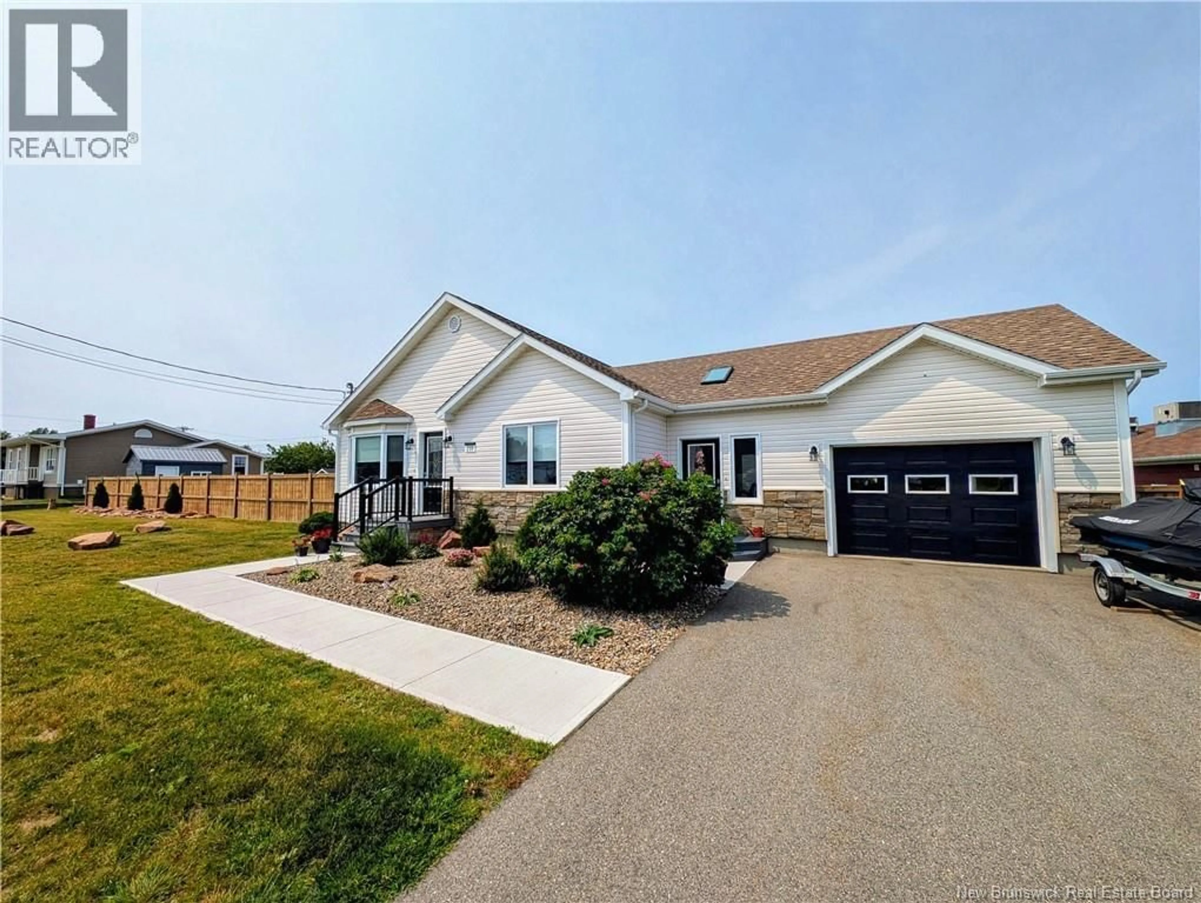 Home with vinyl exterior material, street for 259 RUE SAVARD, Caraquet New Brunswick E1W1A6