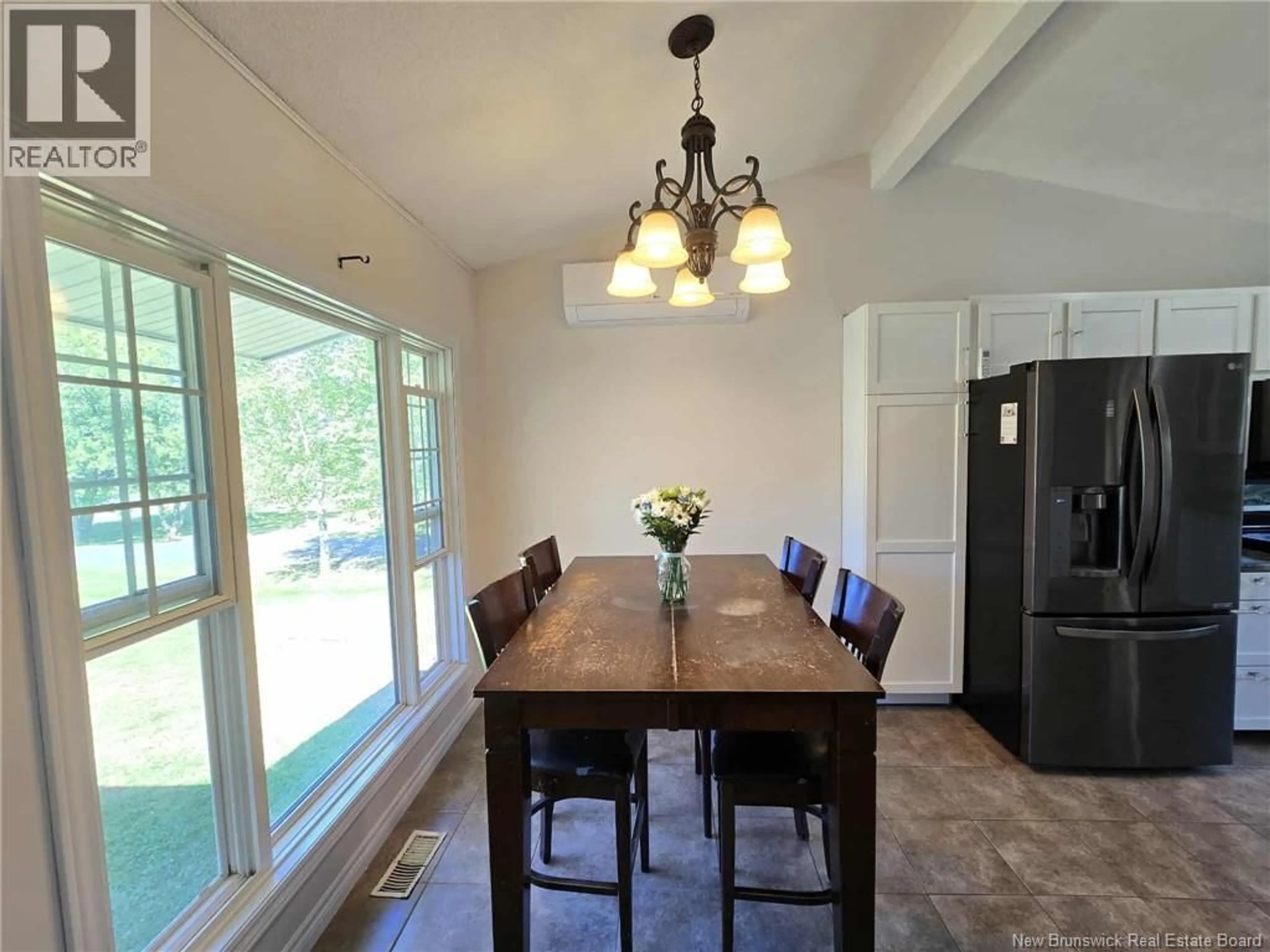 Dining room, wood/laminate floor for 363 HERITAGE STREET, Beresford New Brunswick E8K2C7