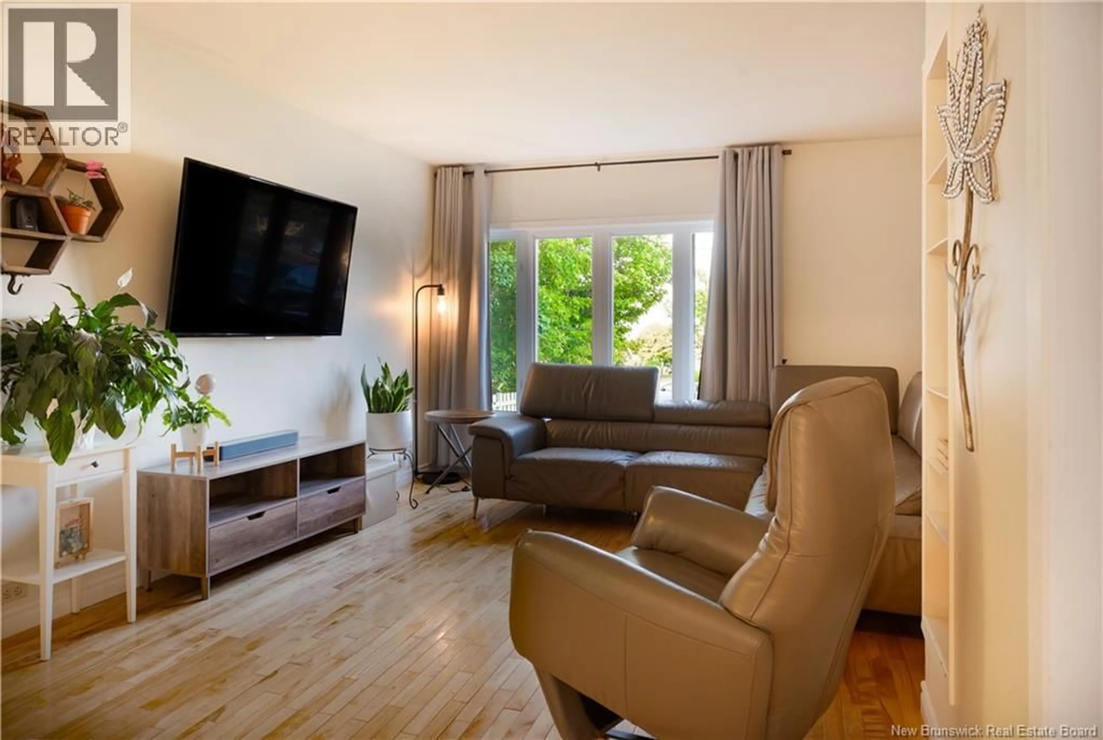 Living room with furniture, wood/laminate floor for 172 D'ASTOUS STREET, Dalhousie New Brunswick E8C1M2
