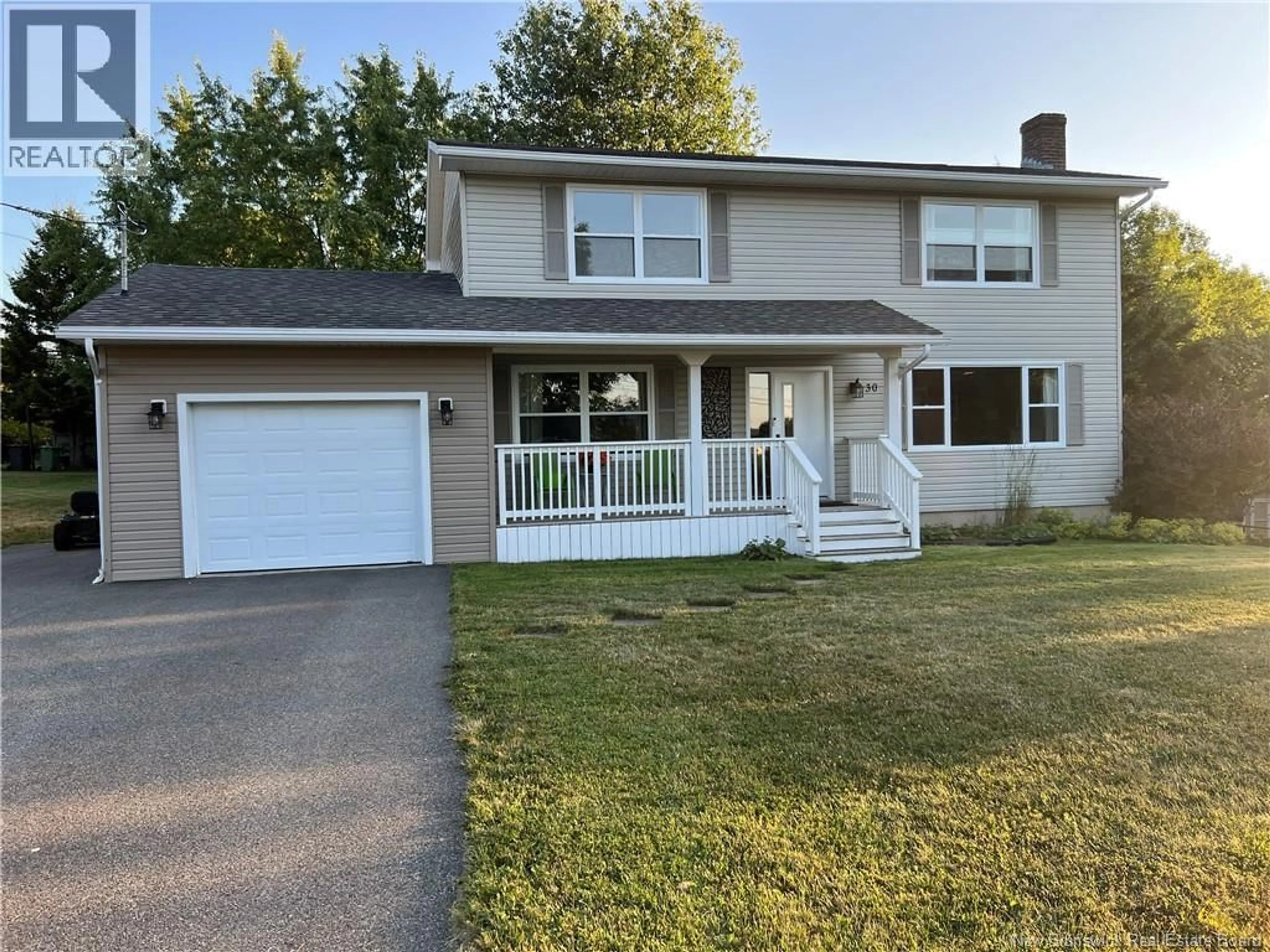 Home with vinyl exterior material, street for 30 SAUNDERS DRIVE, Quispamsis New Brunswick E2E1J7