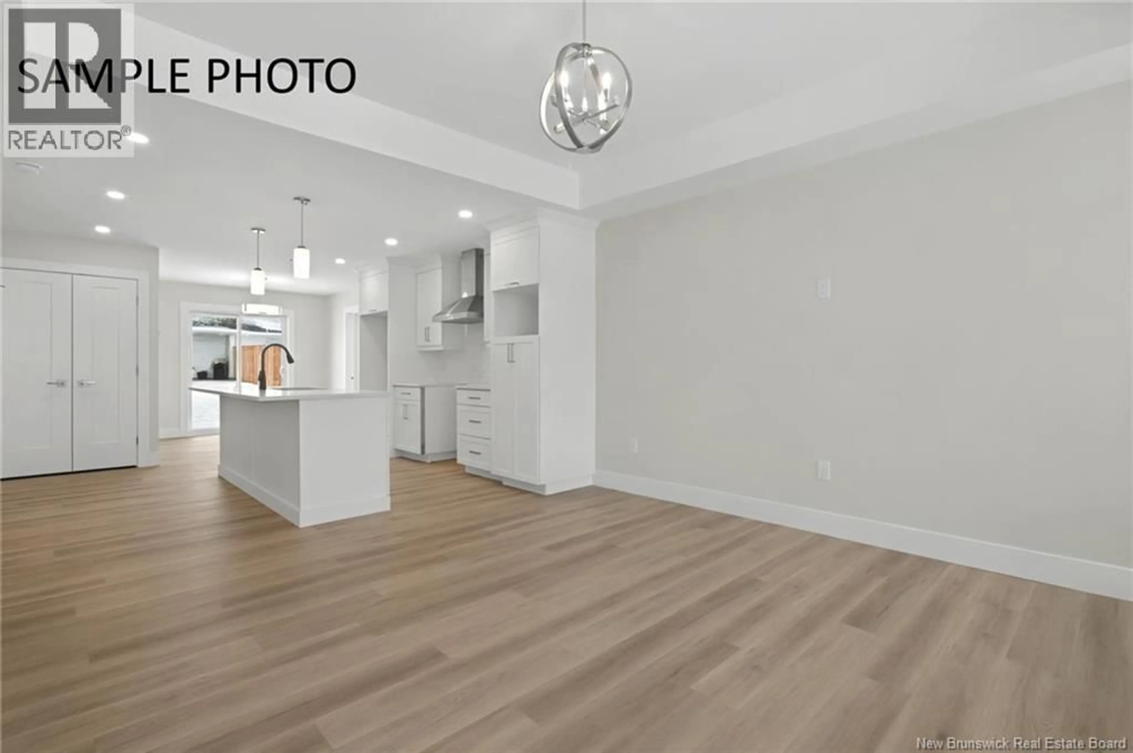 Open concept kitchen, wood/laminate floor for 16 RUBY STREET, Grand-Barachois New Brunswick E4P9H4