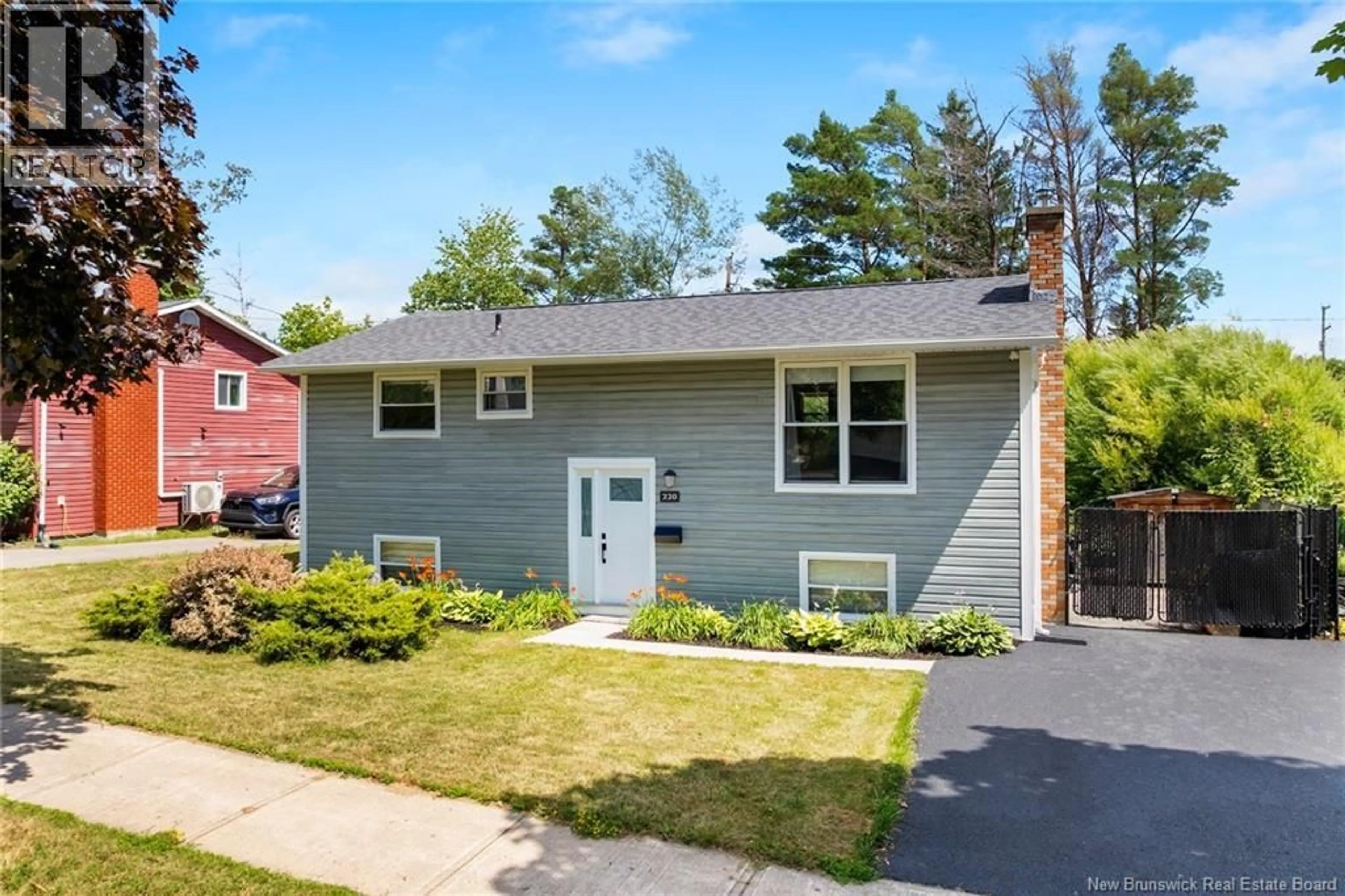 Home with vinyl exterior material, street for 220 MCKEEN STREET, Fredericton New Brunswick E3A2R1