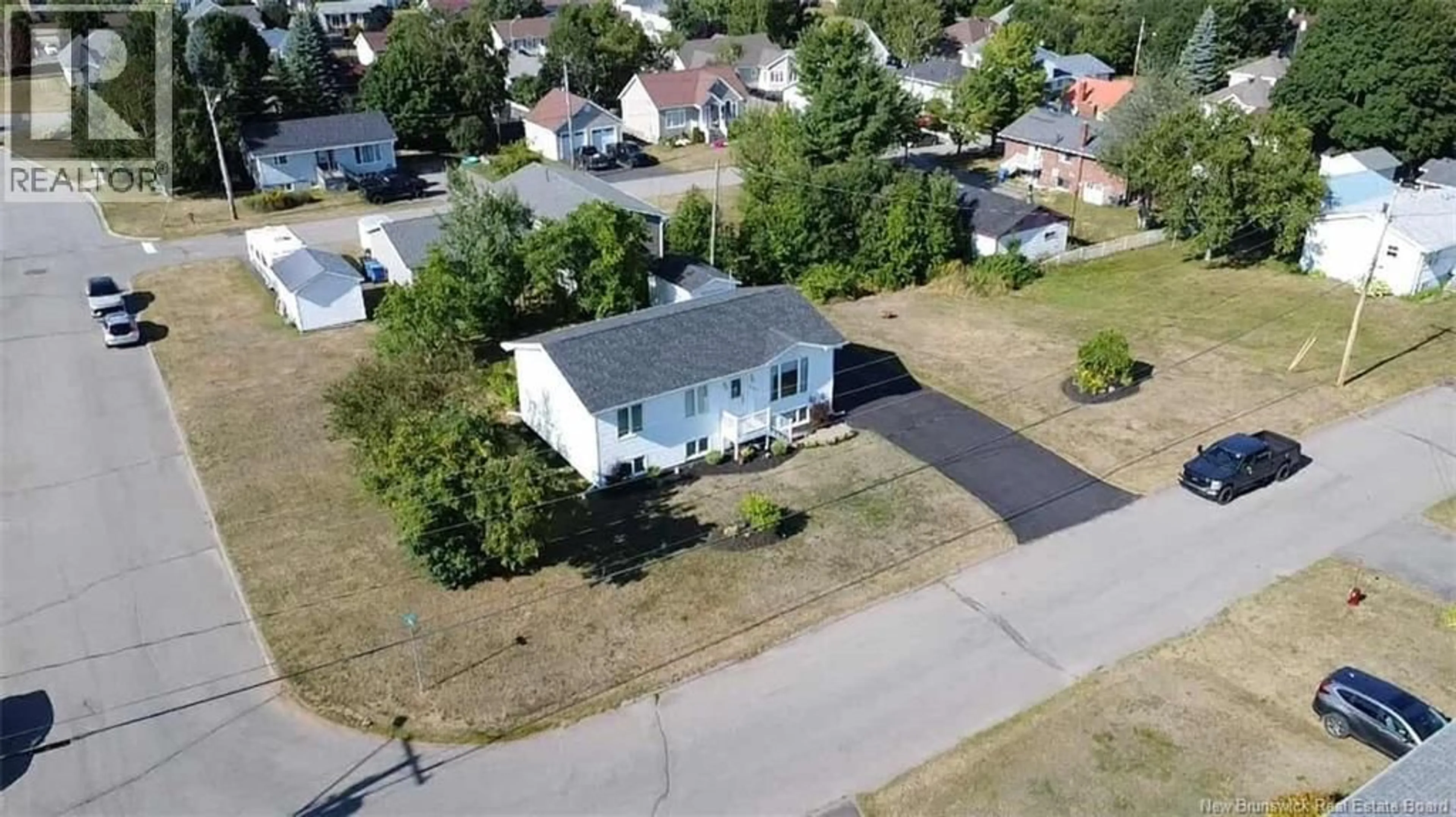 A pic from outside/outdoor area/front of a property/back of a property/a pic from drone, street for 894 POIRIER, Bathurst New Brunswick E2A2T8