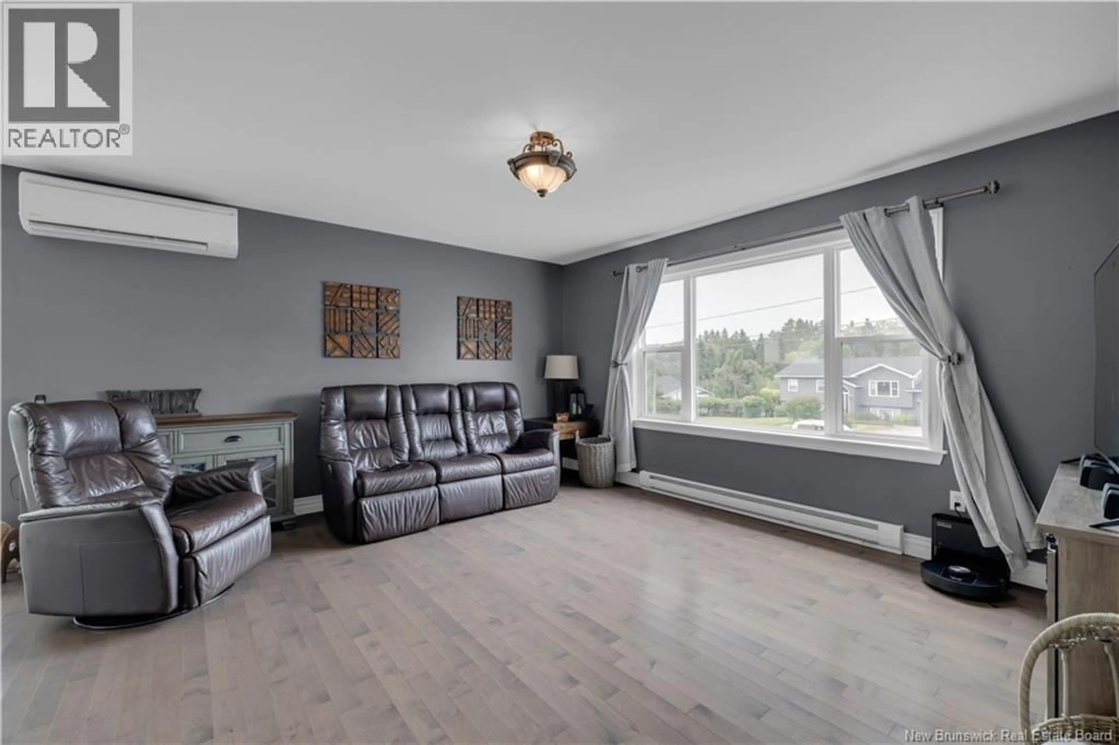 Living room with furniture, wood/laminate floor for 7 GOLDRUSH DRIVE, Quispamsis New Brunswick E2E5Z7