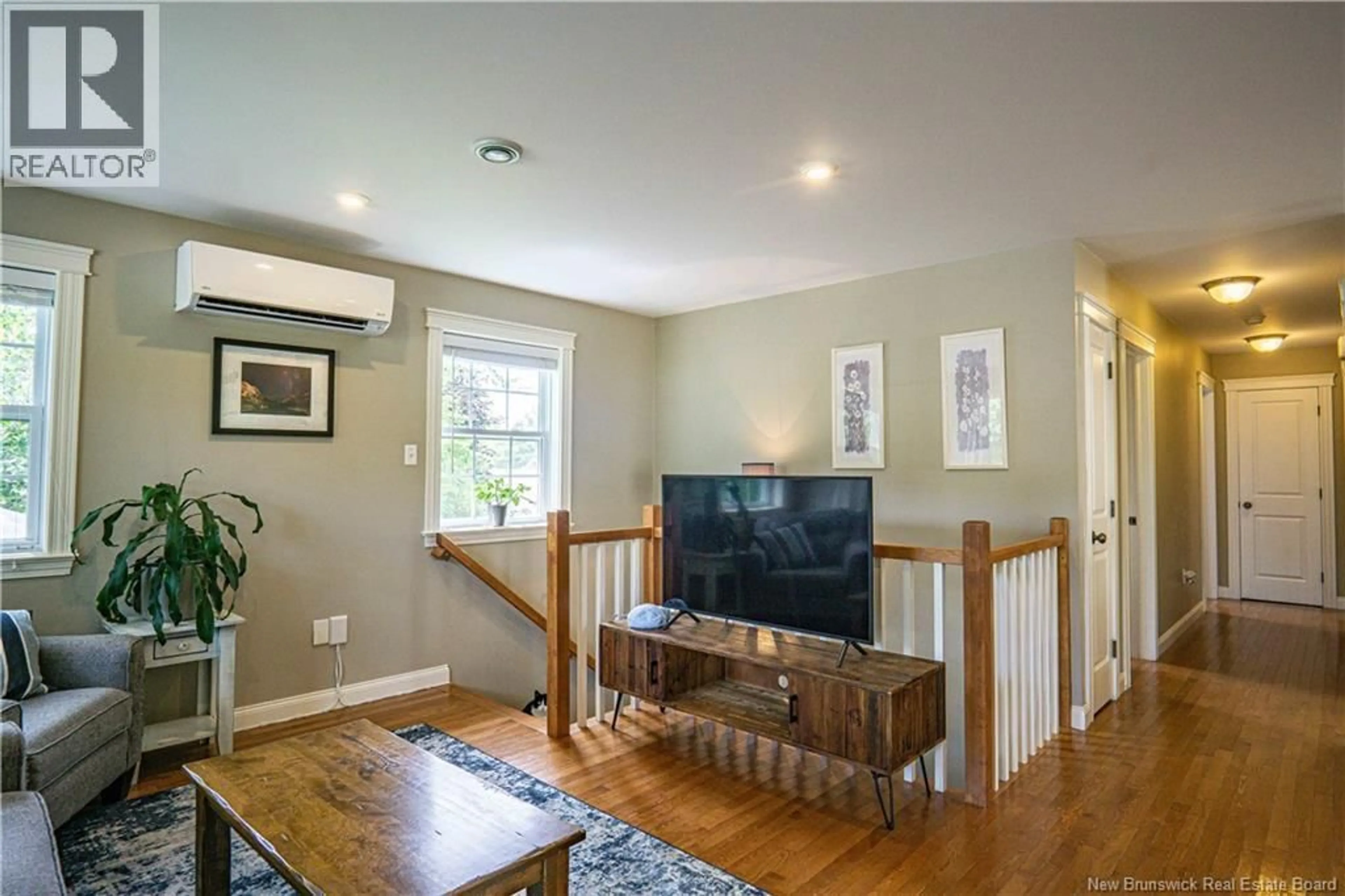 Living room with furniture, wood/laminate floor for 113.5 CLARENCE AVENUE, Fredericton New Brunswick E3A1W3