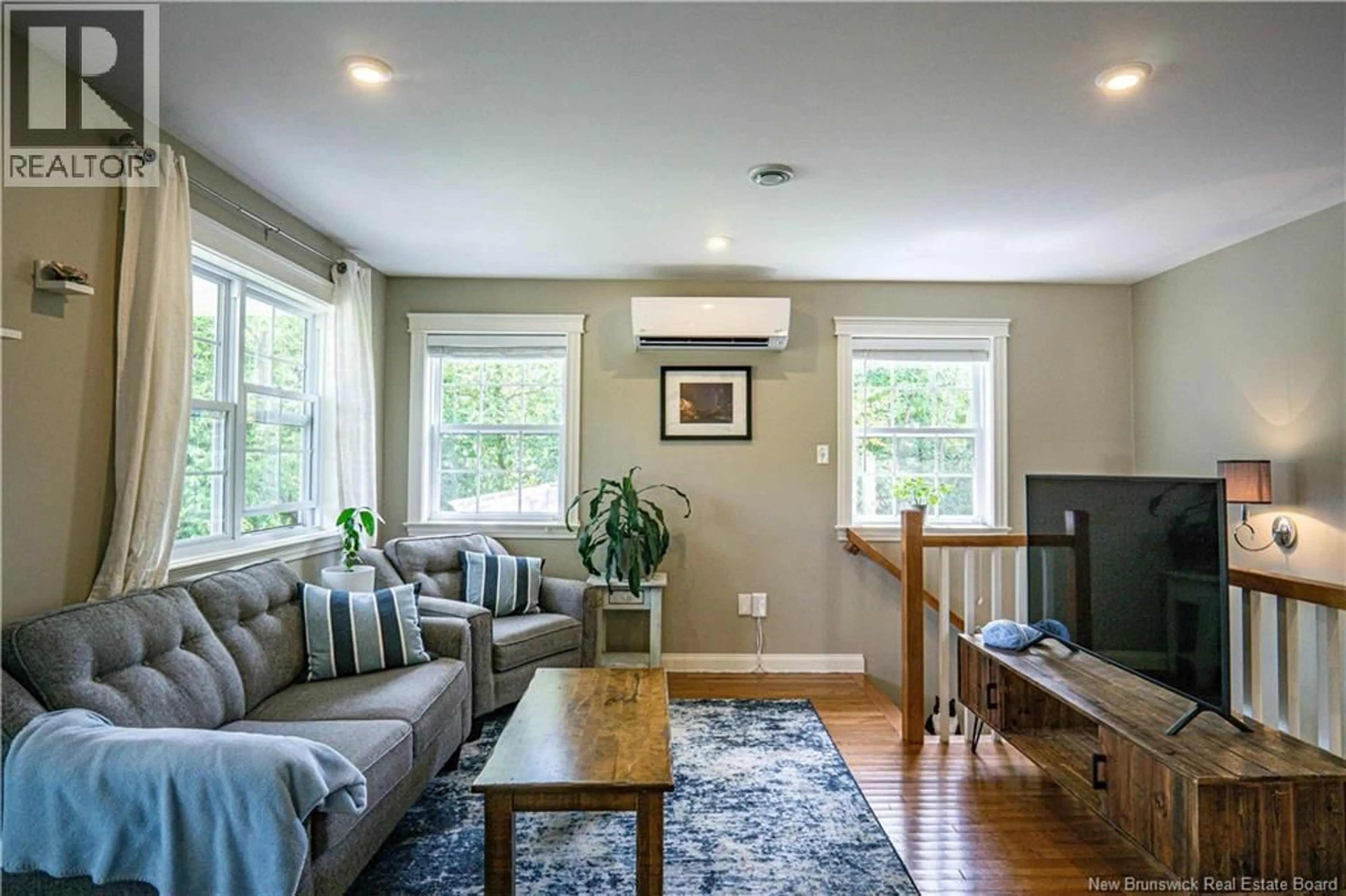 Living room with furniture, wood/laminate floor for 113.5 CLARENCE AVENUE, Fredericton New Brunswick E3A1W3