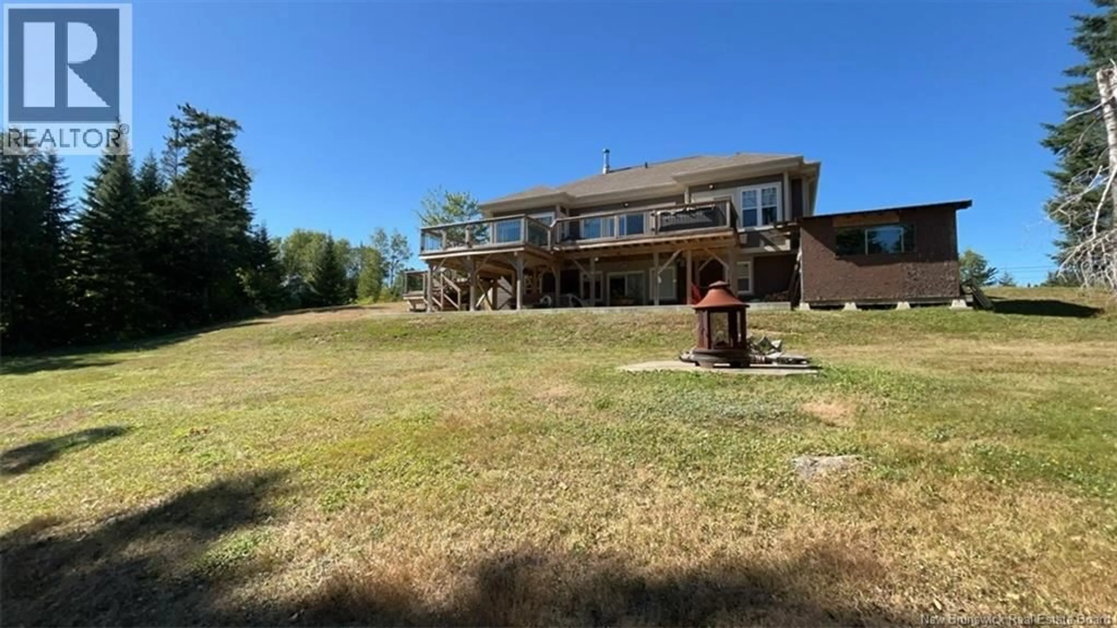 A pic from outside/outdoor area/front of a property/back of a property/a pic from drone, water/lake/river/ocean view for 359 MILLSTREAM, Beresford New Brunswick E8K0C1