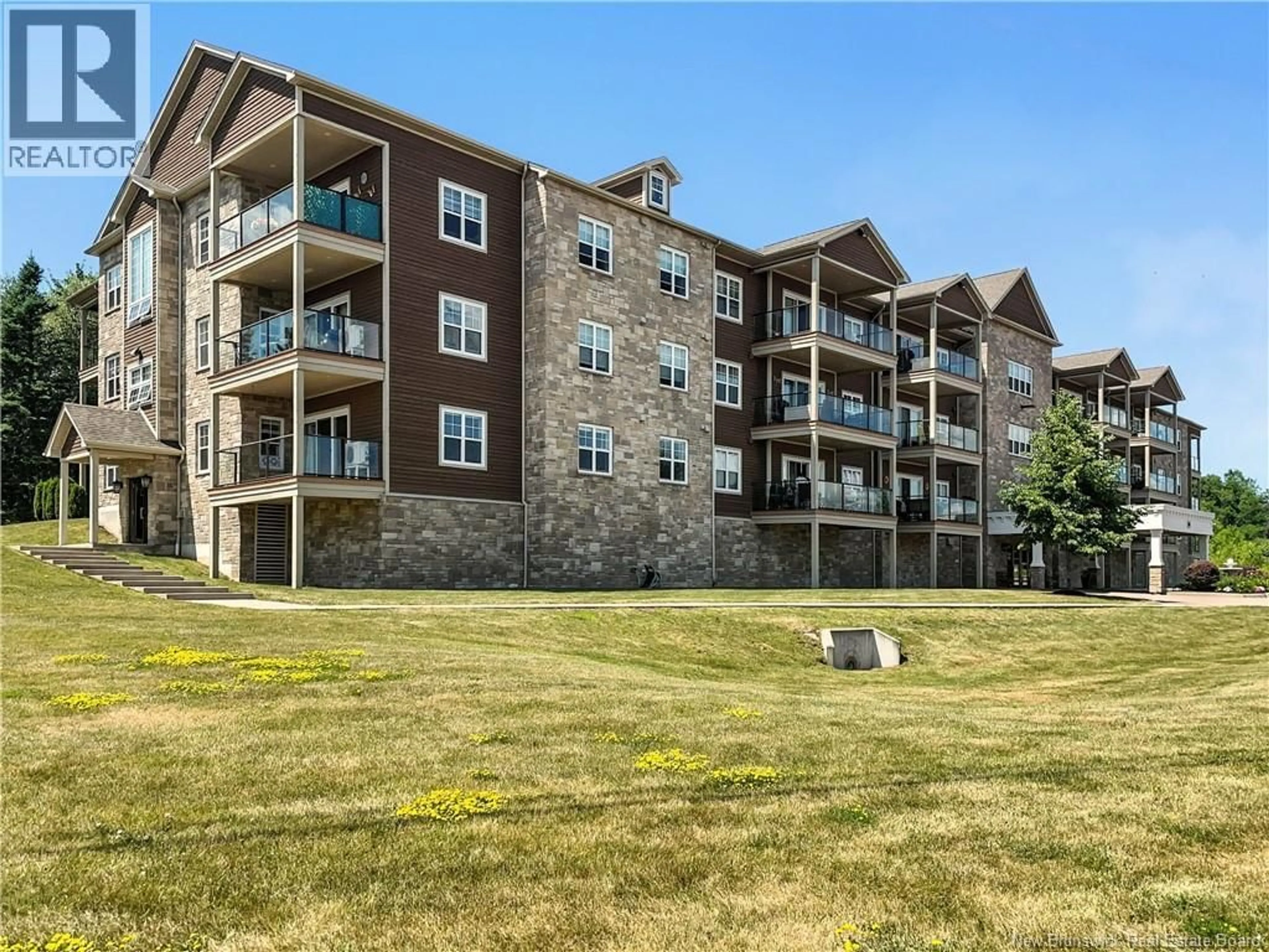 A pic from outside/outdoor area/front of a property/back of a property/a pic from drone, water/lake/river/ocean view for 402 - 88 WOODS TERRACE, Moncton New Brunswick E1G1X6