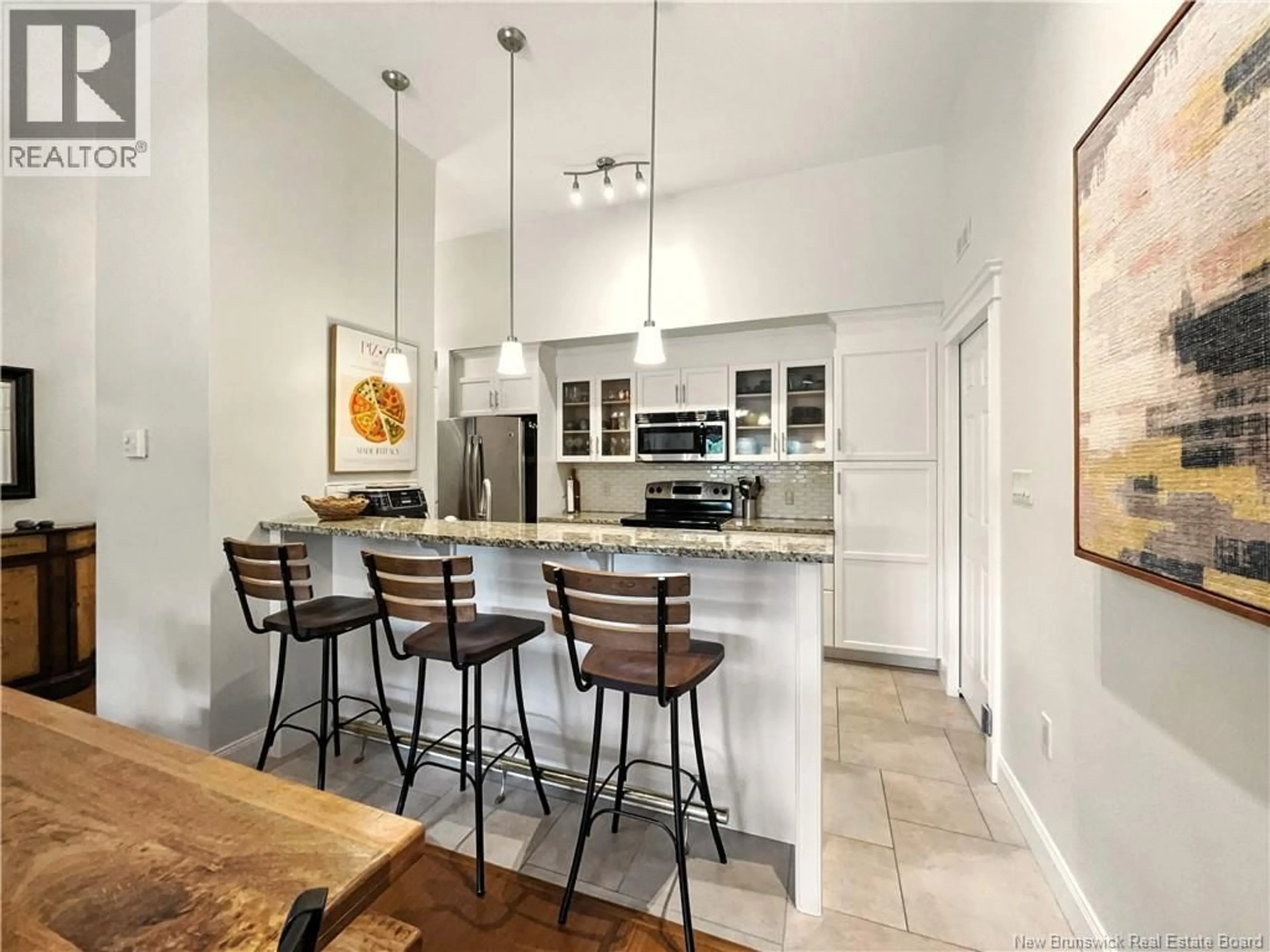 Open concept kitchen, ceramic/tile floor for 402 - 88 WOODS TERRACE, Moncton New Brunswick E1G1X6