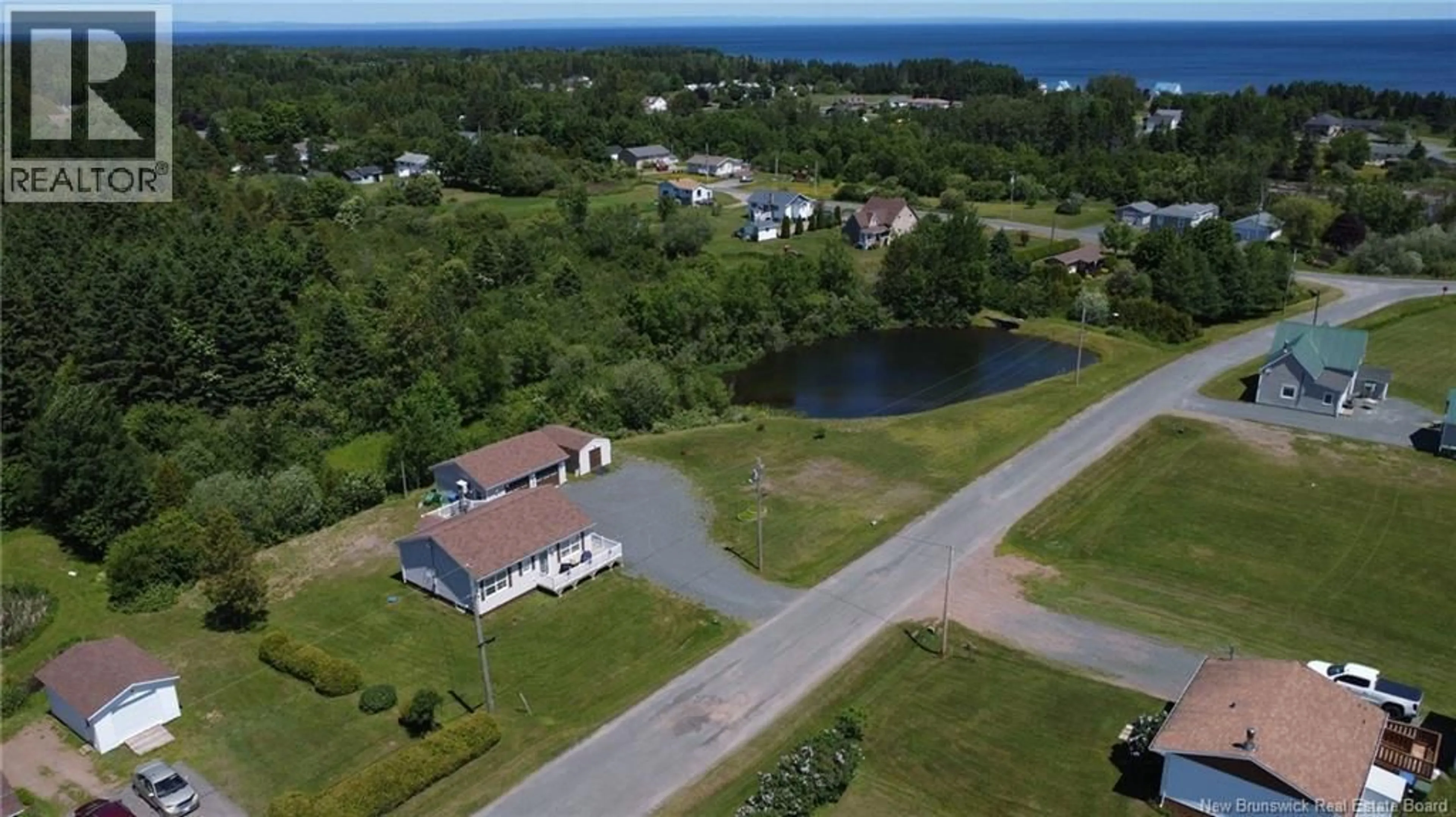 A pic from outside/outdoor area/front of a property/back of a property/a pic from drone, water/lake/river/ocean view for 30 RUE CLAIR RUE, Petit-Rocher-Nord New Brunswick E8J0A1