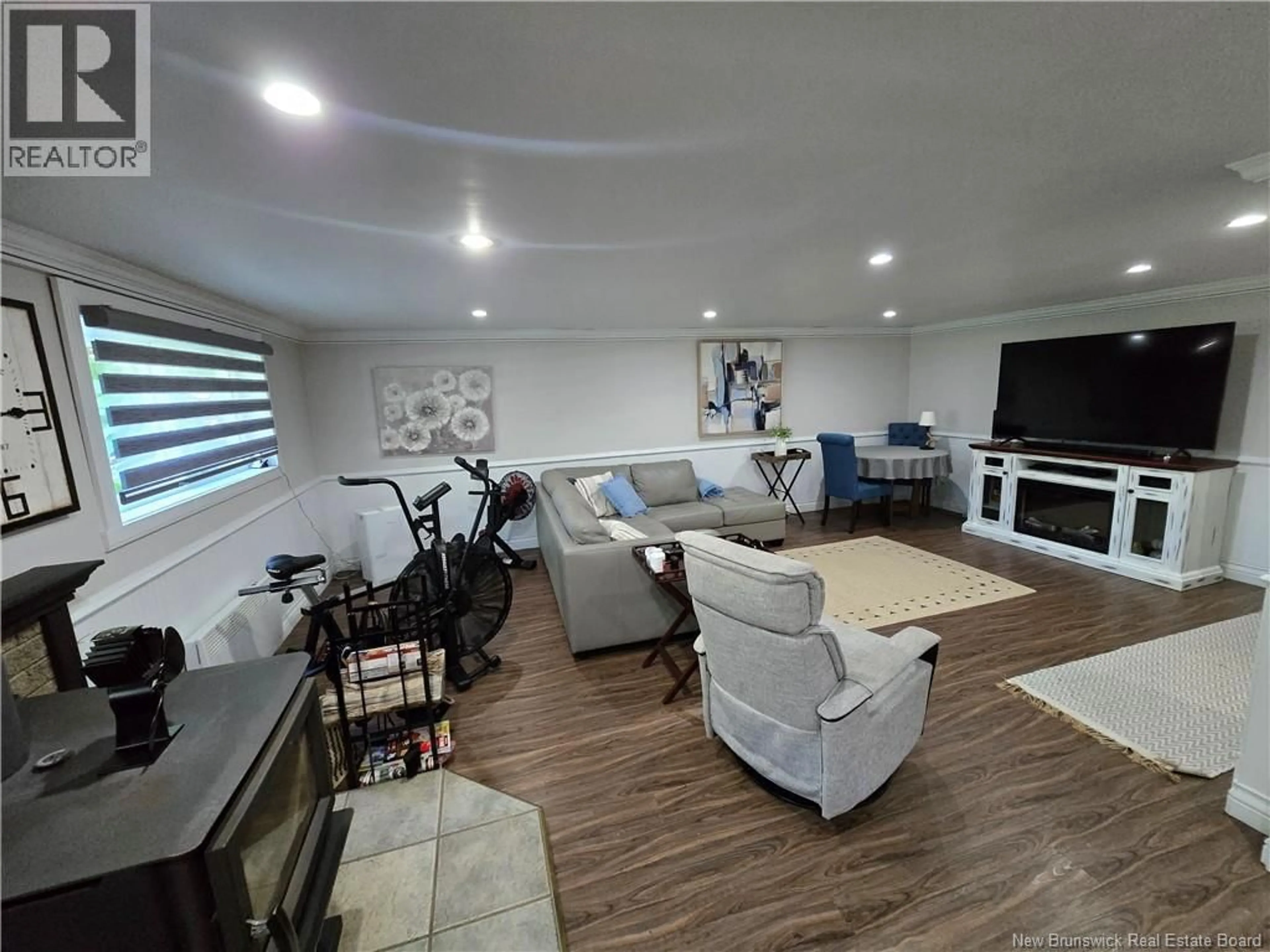 Living room with furniture, wood/laminate floor for 580 CHALEUR STREET, Dunlop New Brunswick E8K2P2