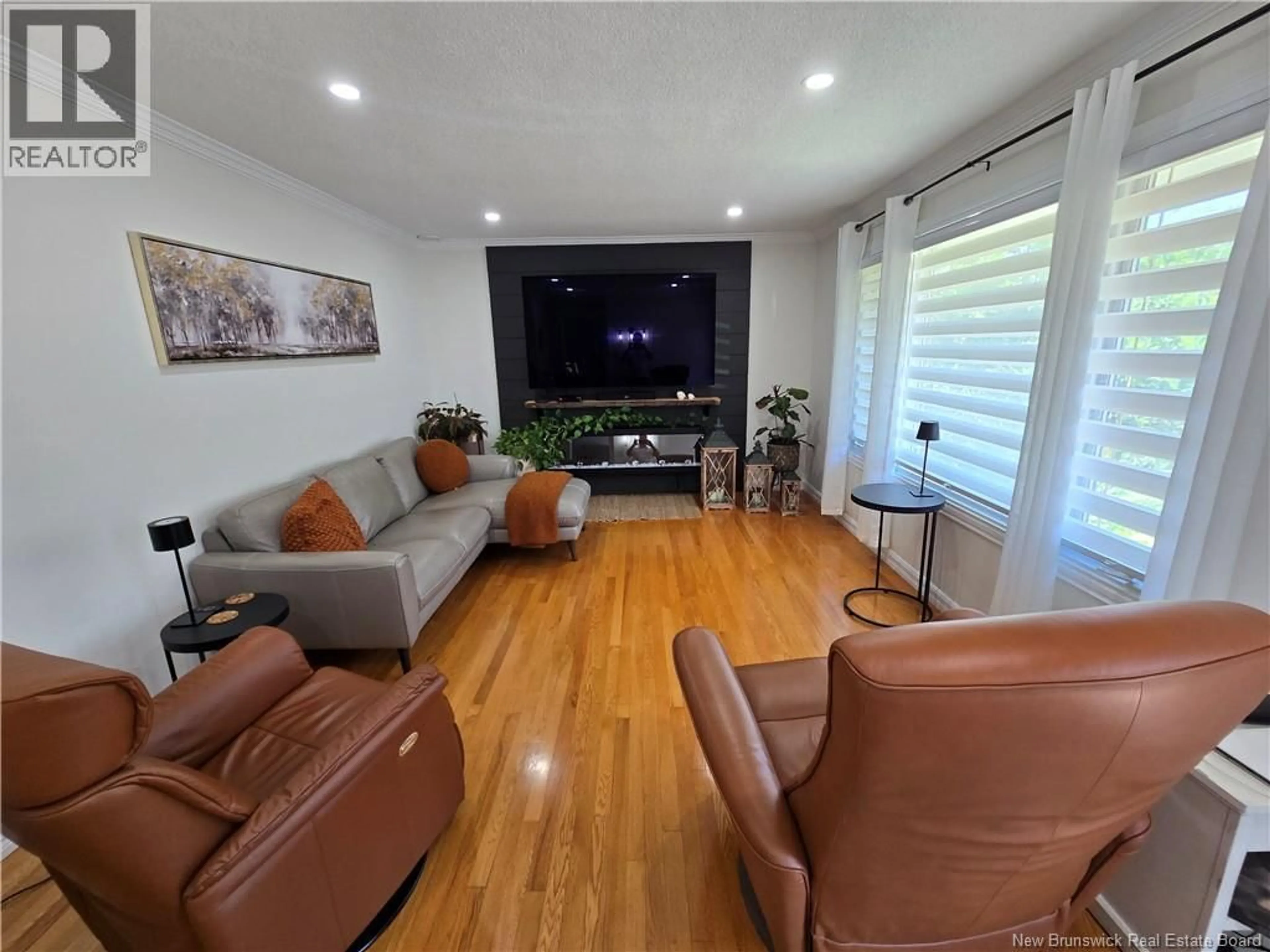 Living room with furniture, wood/laminate floor for 580 CHALEUR STREET, Dunlop New Brunswick E8K2P2