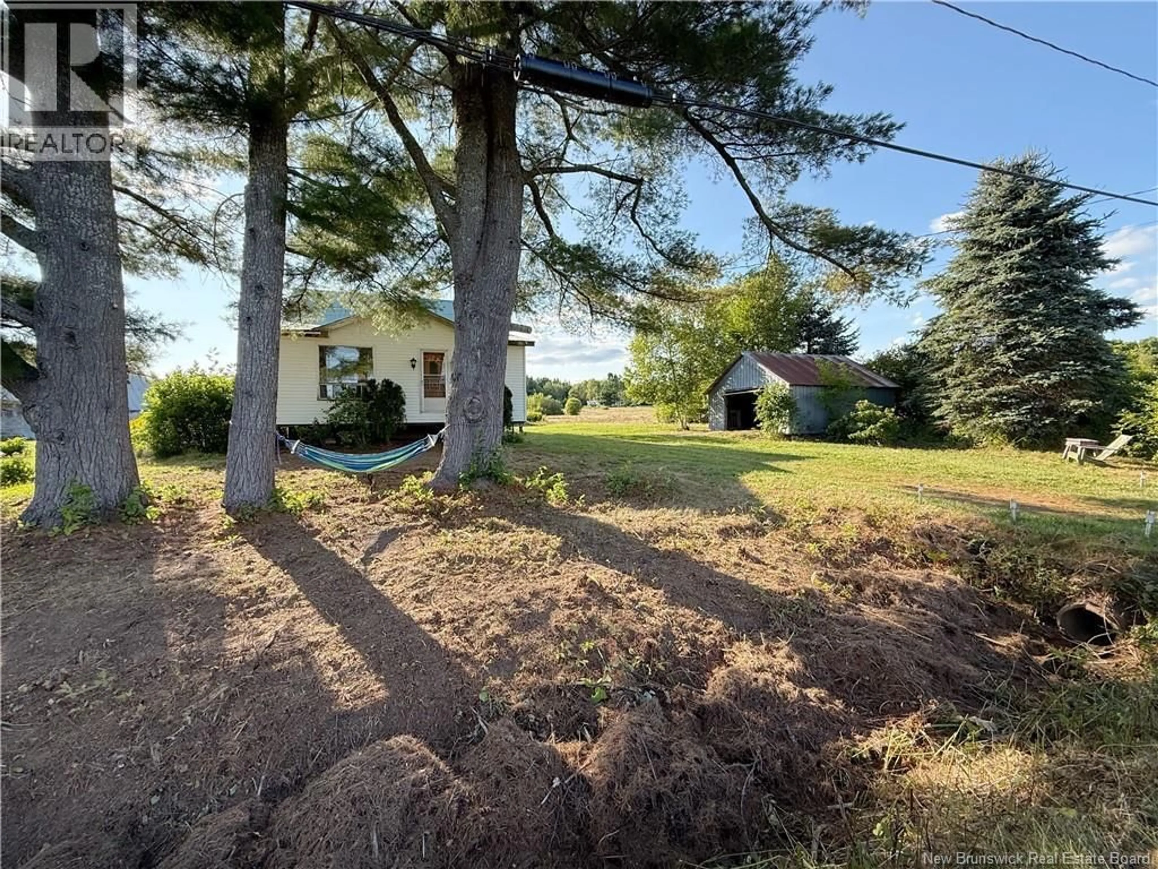 A pic from outside/outdoor area/front of a property/back of a property/a pic from drone, forest/trees view for 76 ROUTE 715, Coles Island New Brunswick E4C2T1