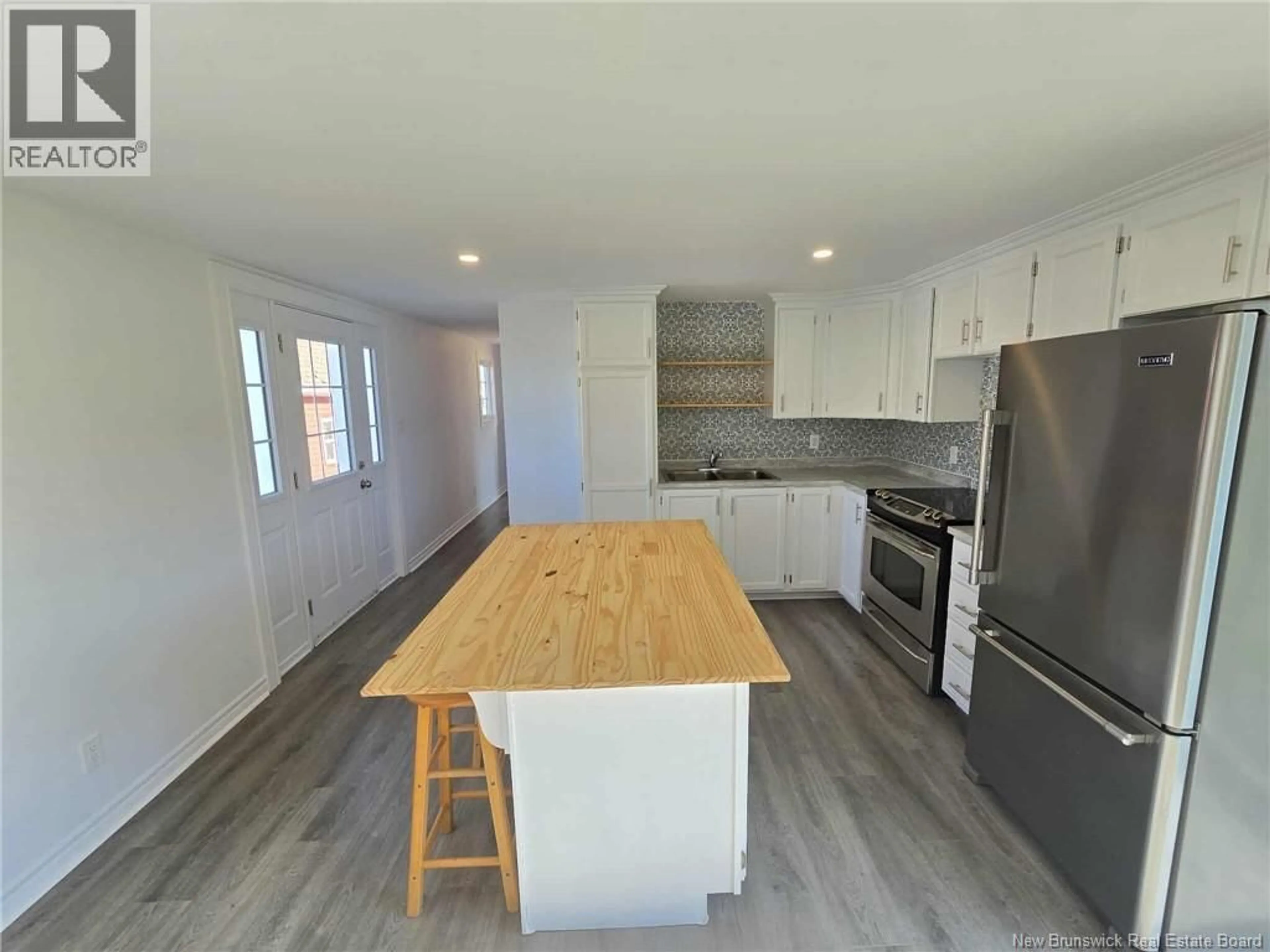 Open concept kitchen, wood/laminate floor for 4576 CAPE ROAD, Salmon Beach New Brunswick E2A6C4